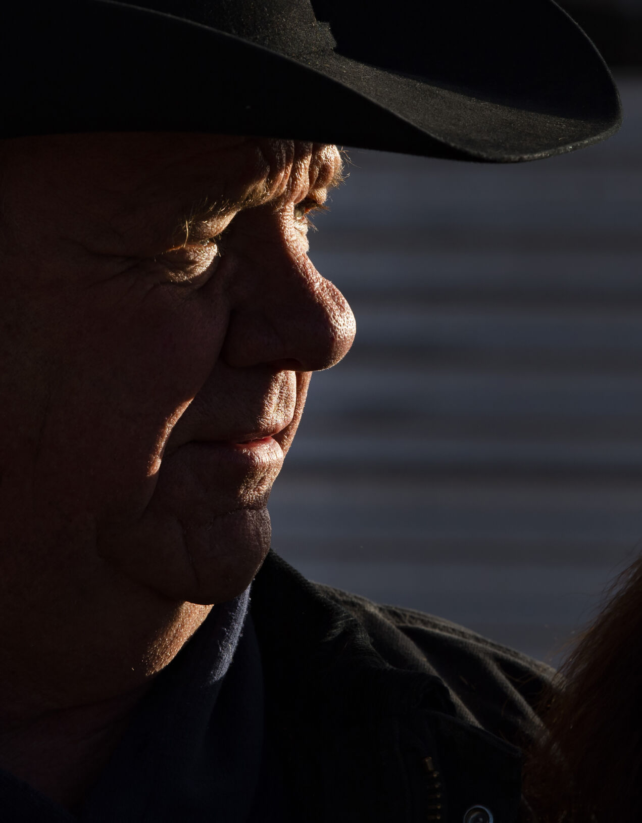 The morning sun spotlights ranch partner Gary Lake at the Silverado Ranch east of Colorado Springs, Wednesday, Jan. 5, 2022. (Christian Murdock, The Gazette)