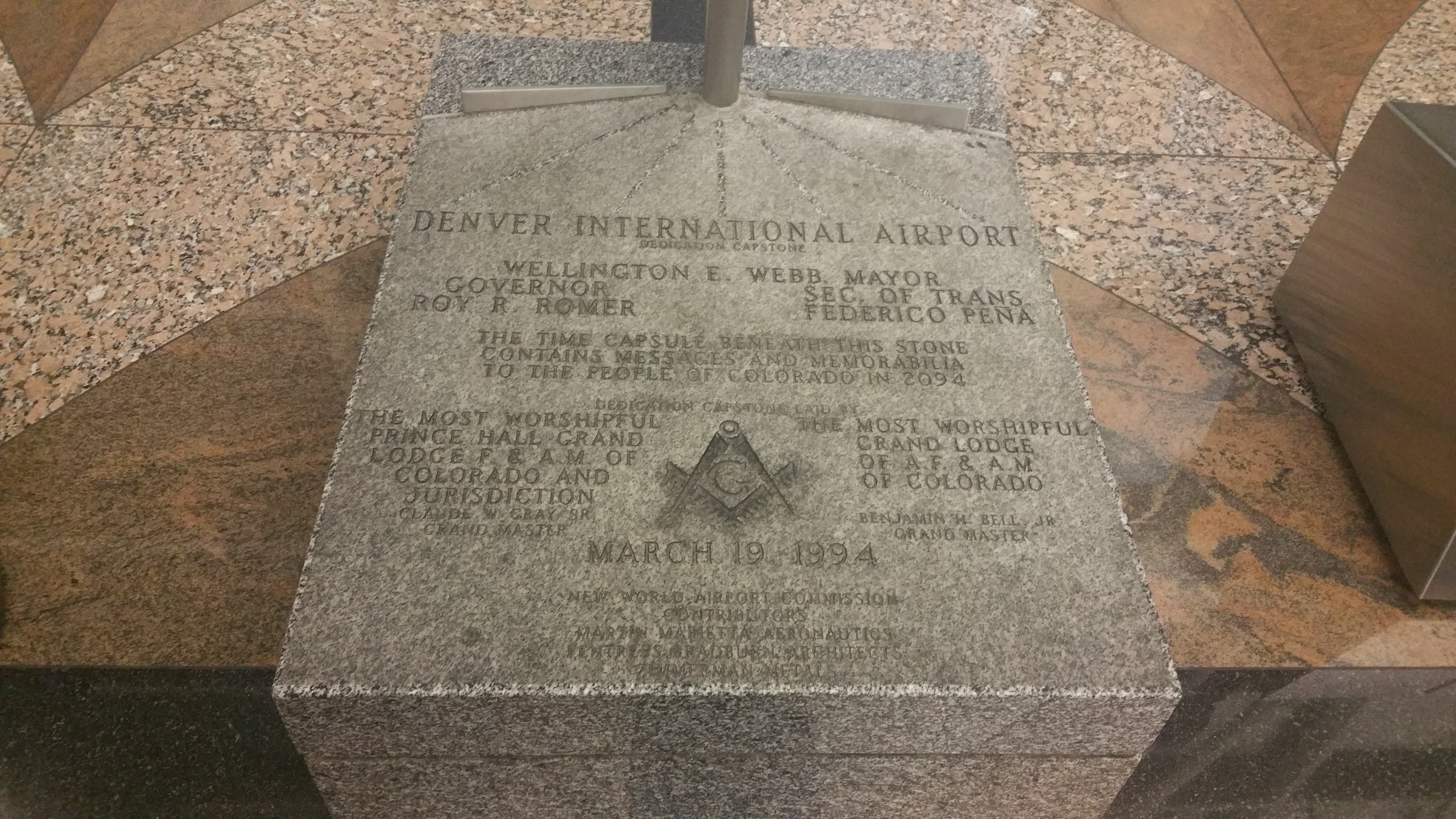 From the symbol to the words 'NEW WORLD AIRPORT COMMISSION,' which can be seen beneath the prominently displayed date, this monument results in plenty of questions from passersby. Photo credit: F4ith.H0p3.Ch4r1ty (Wikimedia Commons)