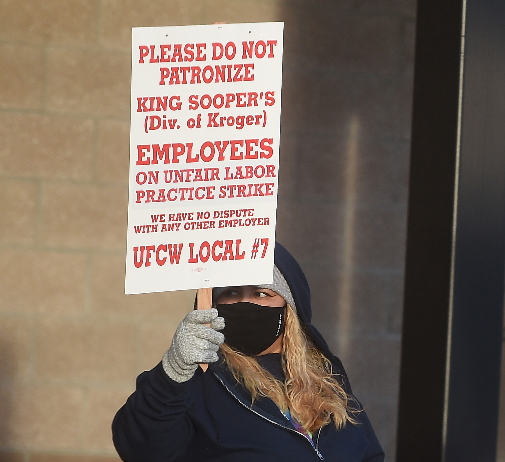 King Soopers employee Valeria Martinez protests in front of the Stroh Ranch King Soopers in Parker. The union workers from most metro Denver area King Soopers went on strike at 5 a.m. Wednesday, Jan. 12, 2022. (Photo by Jerilee Bennett, The Denver Gazette) (Jerilee Bennett/The Denver Gazette)
