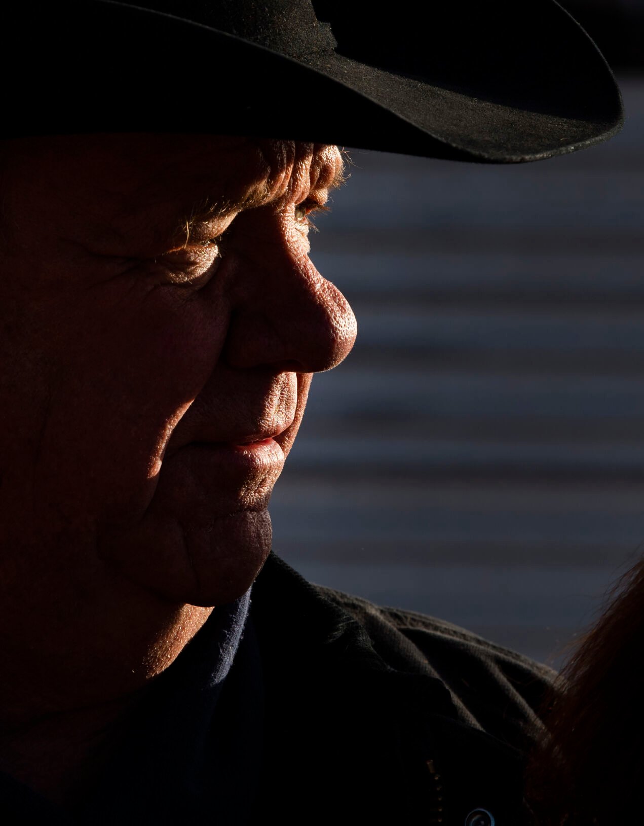 The morning sun spotlights ranch partner Gary Lake at the Silverado Ranch east of Colorado Springs, Wednesday, Jan. 5, 2022. (Christian Murdock, The Gazette)