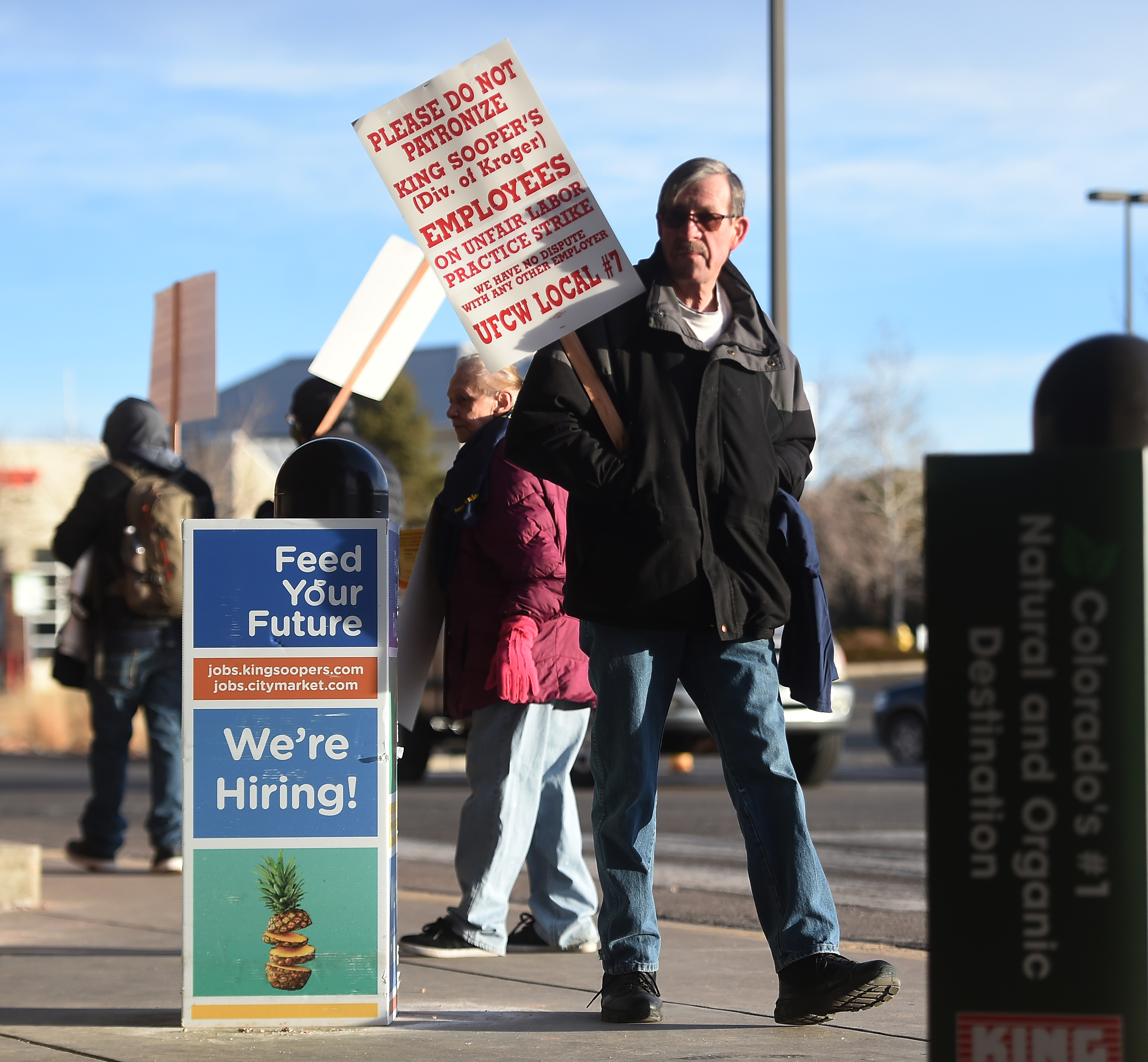 King Soopers employee Burt Osborn walks the picket line at a King Soopers in Parker. The union member workers from King Soopers went on strike at 5 a.m. at most King Soopers in the Denver area. At the Stroh Ranch King Soopers on south Parker Road in Parker picketers were out in force early Wednesday morning on Jan. 12, 2022. (Photo by Jerilee Bennett, The Gazette) (Jerilee Bennett)