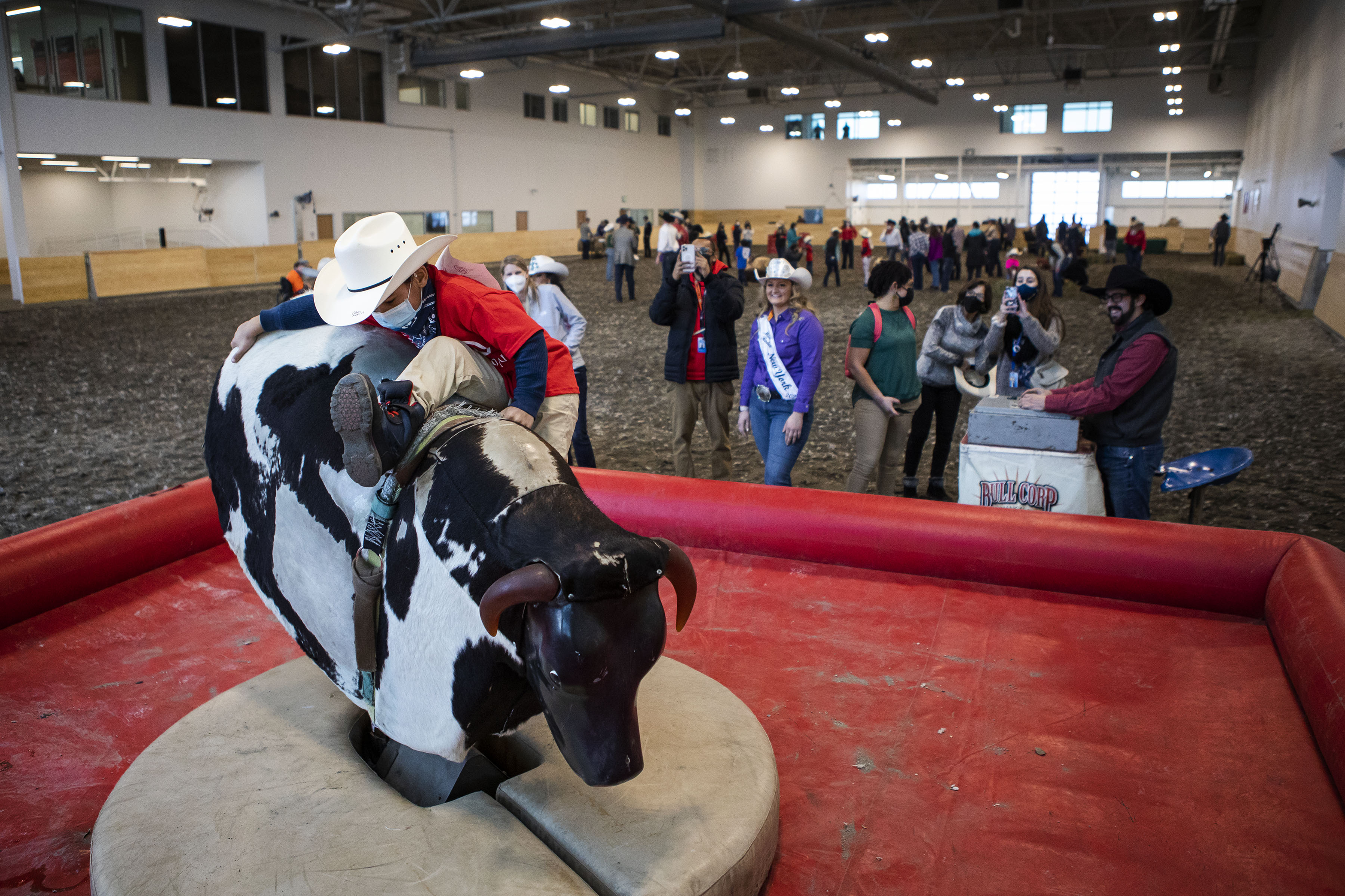 Jeremiah Garner, 6, works hard to stay on the mechanical bull during the Exceptional Rodeo in the Temple Grandin Equine Center on Thursday, Jan. 20, 2022, at the CSU Spur Campus in Denver, Colo. (Timothy Hurst/The Gazette) (Timothy Hurst)