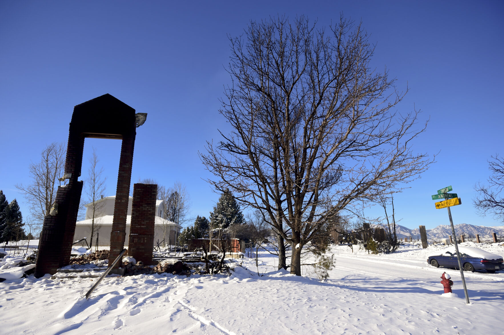 LOUISVILLE, CO - JANUARY 2:What remains of a home on the corner of St. Andrews Lane and Troon Court is seen during a tour of the Marshall Fire burn area in Louisville on Sunday, Jan. 2, 2022. The current estimate of destroyed structures is 991, while 127 structures are damaged according to Boulder County Sheriff Joe Pelle. (Matthew Jonas/Boulder Daily Camera/Pool) (Matthew Jonas)