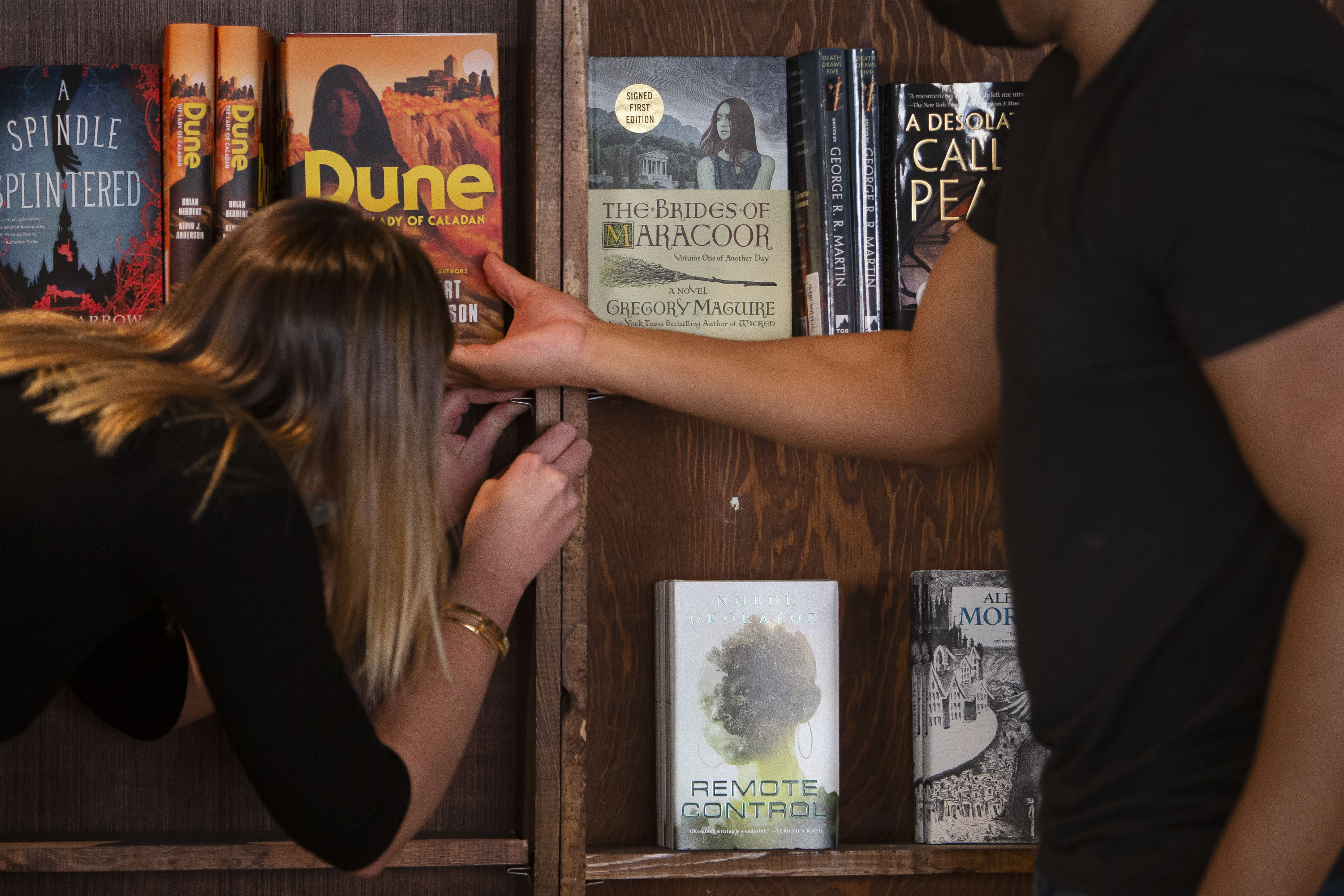 Tattered Cover Book Store CEO Kwame Spearman, right, and chief marketing officer Katherine Rainbolt stock the shelves of the new science section Tuesday in preparation of the store opening its newest location in Westminster. (TimHursttim.hurst@gazette.comhttps://secure.gravatar.com/avatar/aca82bd62b4ee425c598527cd6faa1b1?d=mm&r=g)