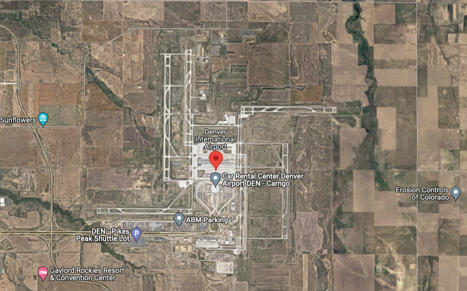 Here's what Denver International Airport looks like from above. Conspiracy theorists claim that the runways form the shape of a swastika, spanning out from the center of the airport (marked with the red pin). Do the runways fan out in a way similar to a Swastika – maybe – but is this connection one that was made on purpose? Many say this is unlikely – merely the most efficient and safest design to have four simultaneously operating runways at an airport, each sending planes away in different directions. Image Credit: @2022 Google Maps.