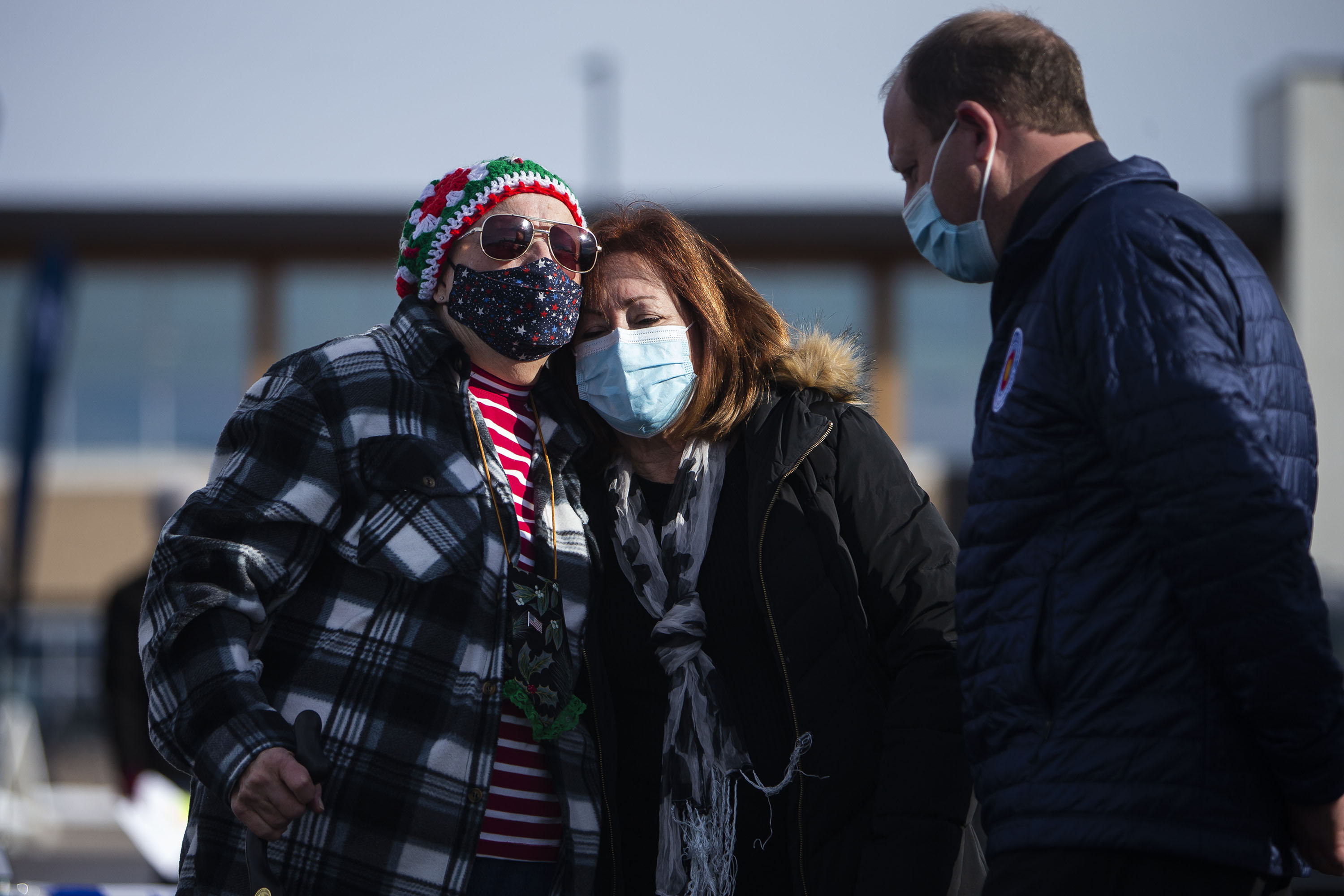 Superior resident Gladys Forshee hugs Colorado Lt. Gov. Dianne Primavera while Gov. Jared Polis visits with Forshee at the Disaster Assistance Center at on Monday, Jan. 3, 2022, at 1755 South Public Road in Lafayette, Colo. (Timothy Hurst/The Gazette) (Timothy Hurst)