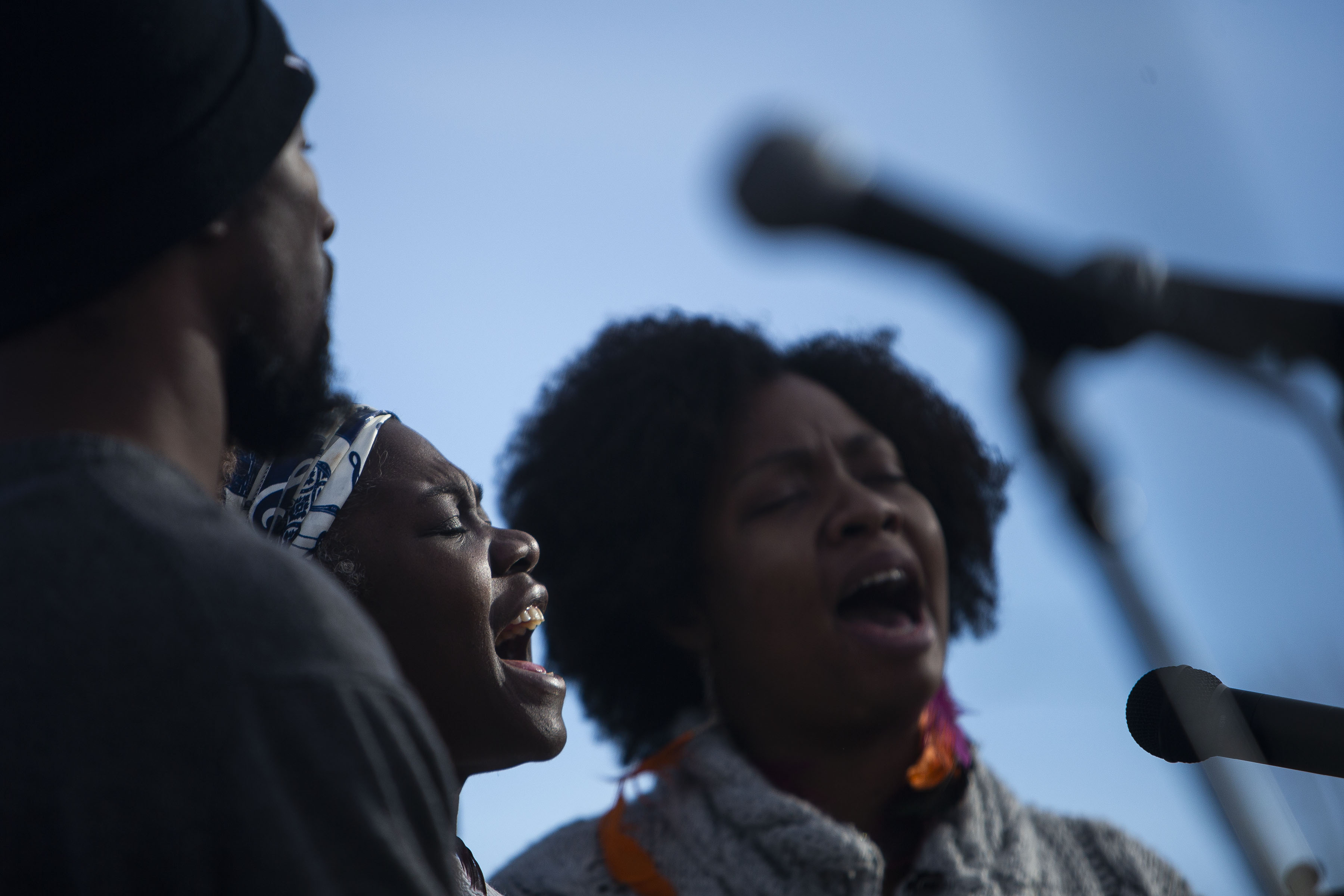 Spirit of Grace gospel group members, from left, Raymond Groves IV, Larea Edwards Christin Grant sing the Black National Anthem during the Martin Luther King Marade on Monday, Jan. 17, 2022, in Denver, Colo. (Timothy Hurst/The Gazette) (Timothy Hurst)