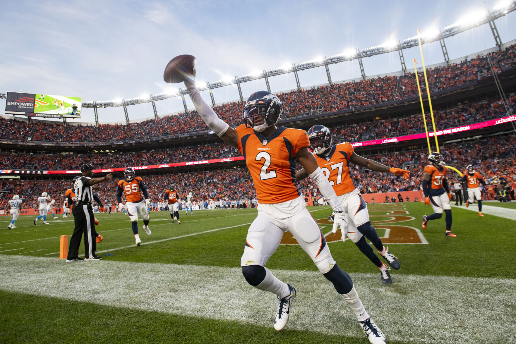 Broncos cornerback Pat Surtain II celebrates in the end zone after intercepting Chargers quarterback Justin Herbert on Sunday in Denver. Surtain finished with two interceptions against the AFC West rival. Despite the Broncos finishing November with two wins and a loss, Colorado Sports betting declined slightly from October's record total. (Christian Murdock, The Denver Gazette)