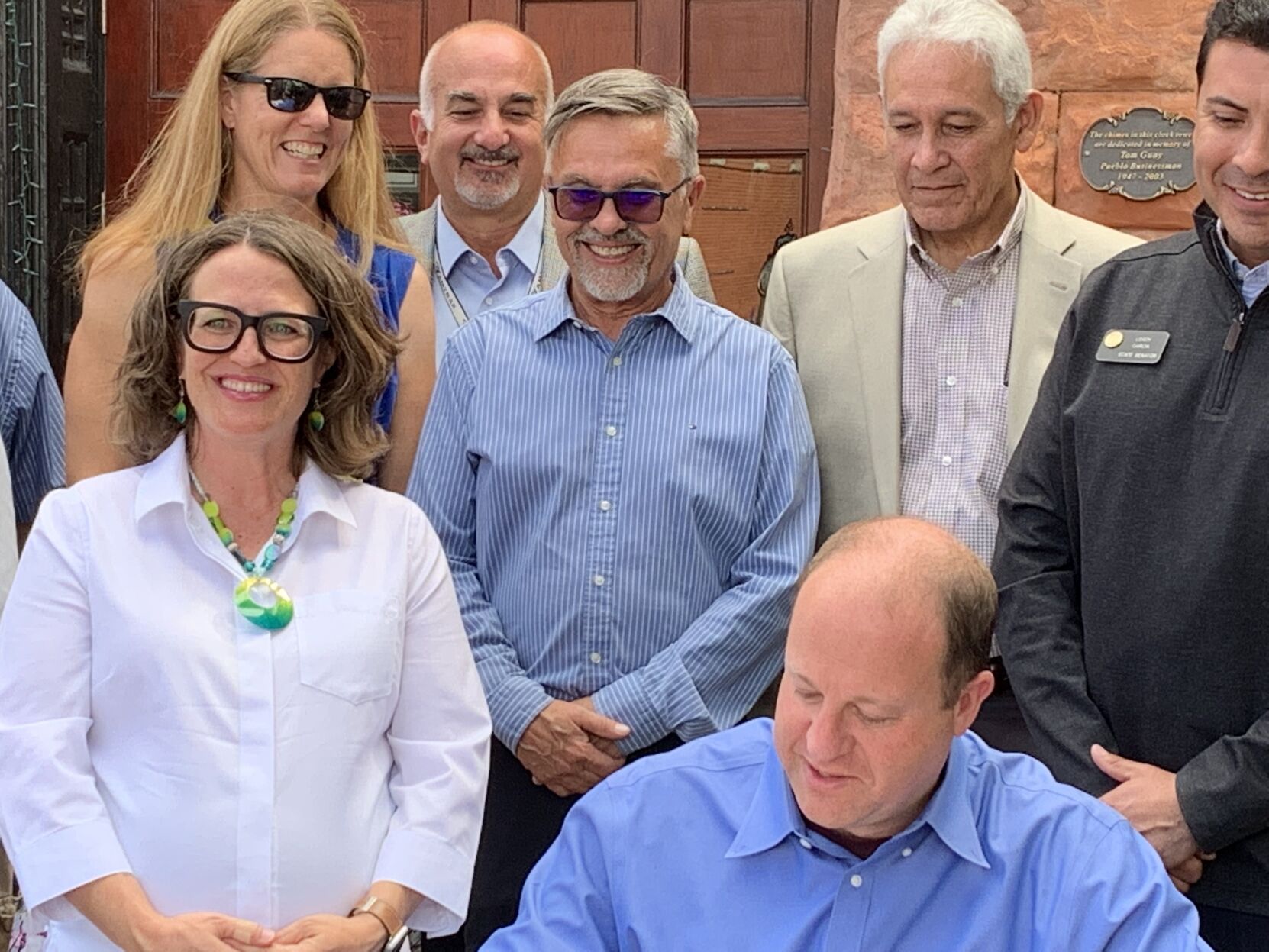 Gov. Jared Polis signs Senate Bill 238 with House Majority Leader Daneya Esgar and Senate President Leroy Garcia, both of Pueblo, watching on (MarianneGoodlandmarianne.goodland@coloradopolitics.comhttps://secure.gravatar.com/avatar/125a14b7bd9266f61a445ec13b1d3605?d=mm&r=g)