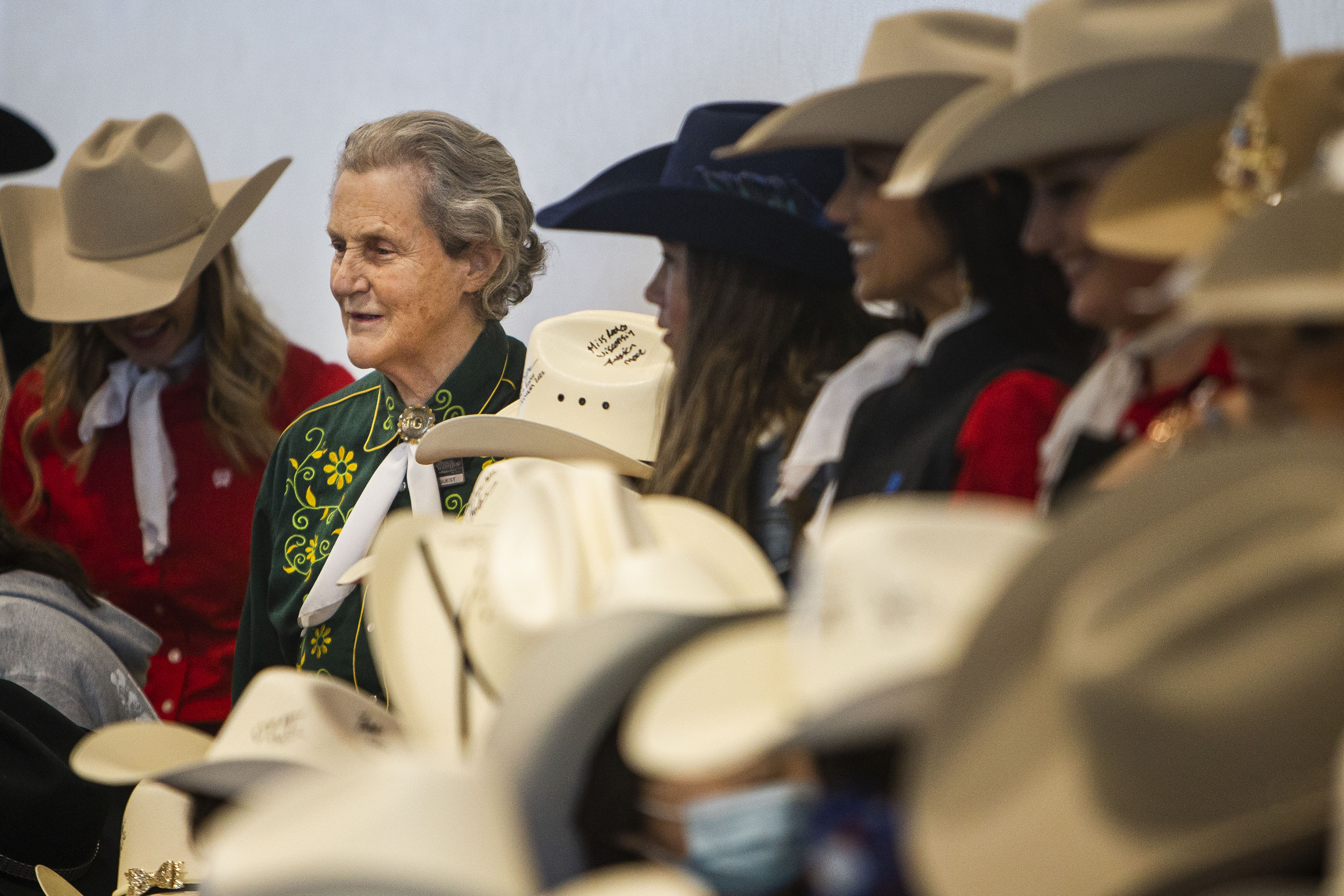Temple Grandin lines up for a photo with all the participants of the Exceptional Rodeo at the Temple Grandin Equine Center on Thursday, Jan. 20, 2022, at the CSU Spur Campus in Denver, Colo. (Timothy Hurst/The Gazette) (Timothy Hurst)