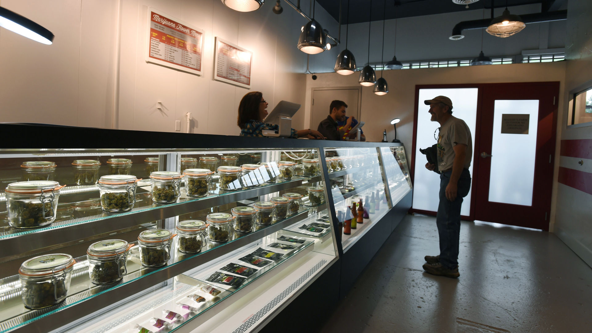 A man looks over a case full of marijuana possibilities in 2014 at Maggie’s Farm in Manitou Springs, which was the first recreational marijuana store in El Paso County. In a special election Tuesday, Jan. 18, 2022, Manitou Springs voters will decide whether to allow a third marijuana shop within city limits. Currently, the city permits the operation of no more than two dual-operation medical and retail marijuana facilities. (Jerilee Bennett, The Gazette file)