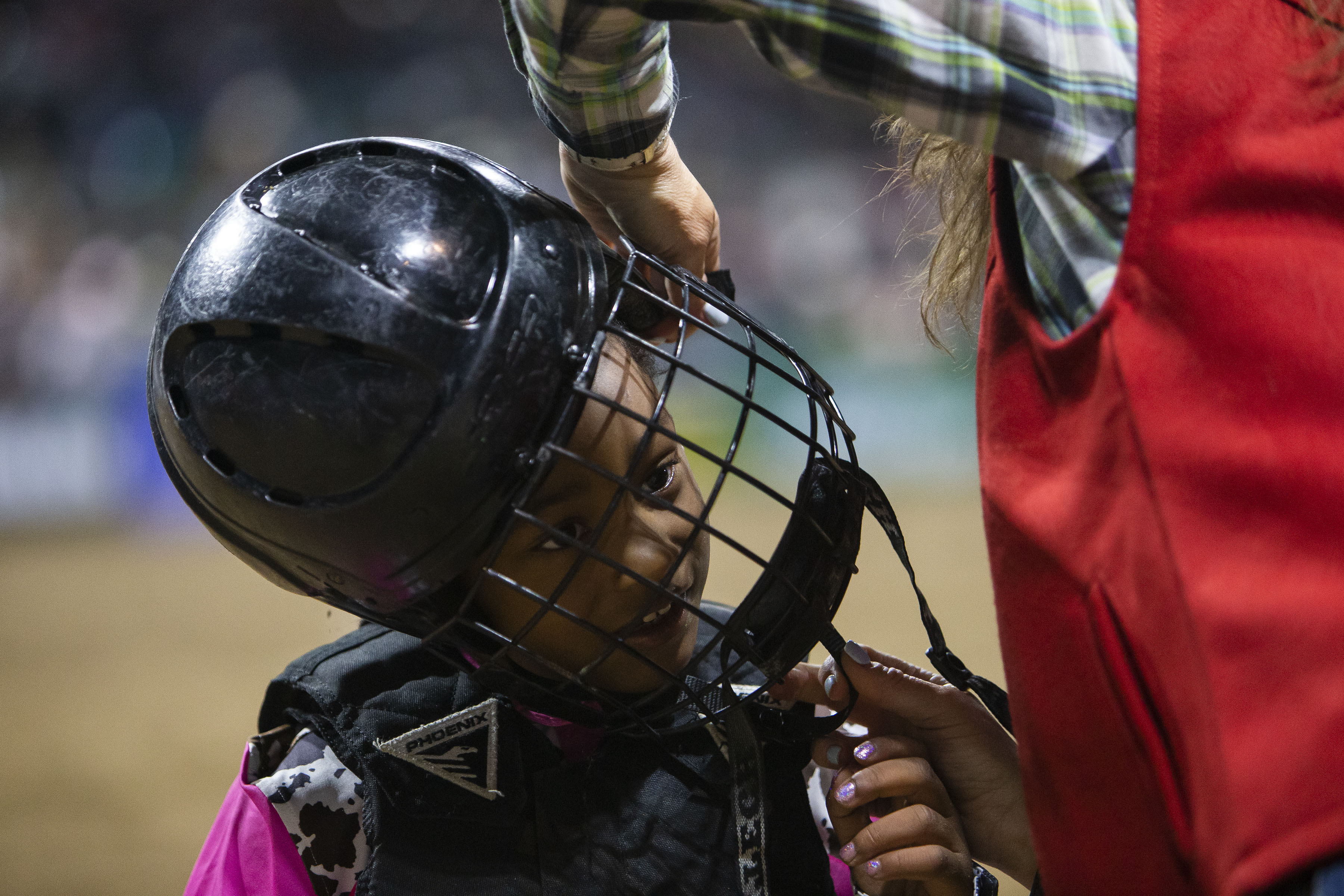 Kendall Henderson is all smiles while having her helmet removed after participating in the mitten busting show during the African-American Heritage Rodeo at the National Western Stock Show on Monday, Jan. 17, 2022, in Denver, Colo. (Timothy Hurst/The Gazette) (Timothy Hurst)