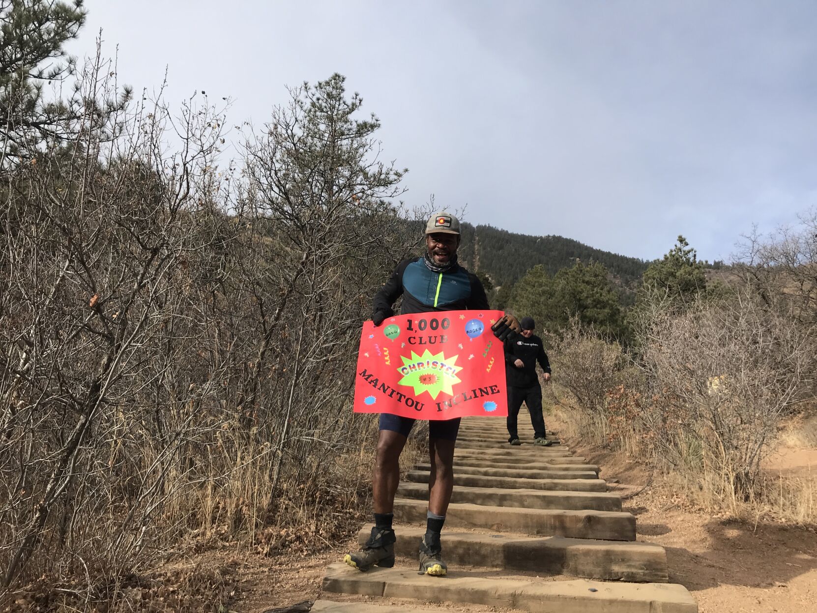 Christel Aime celebrates 1,001 Incline climbs in a year with a poster. (Seth Boster, The denver Gazette)