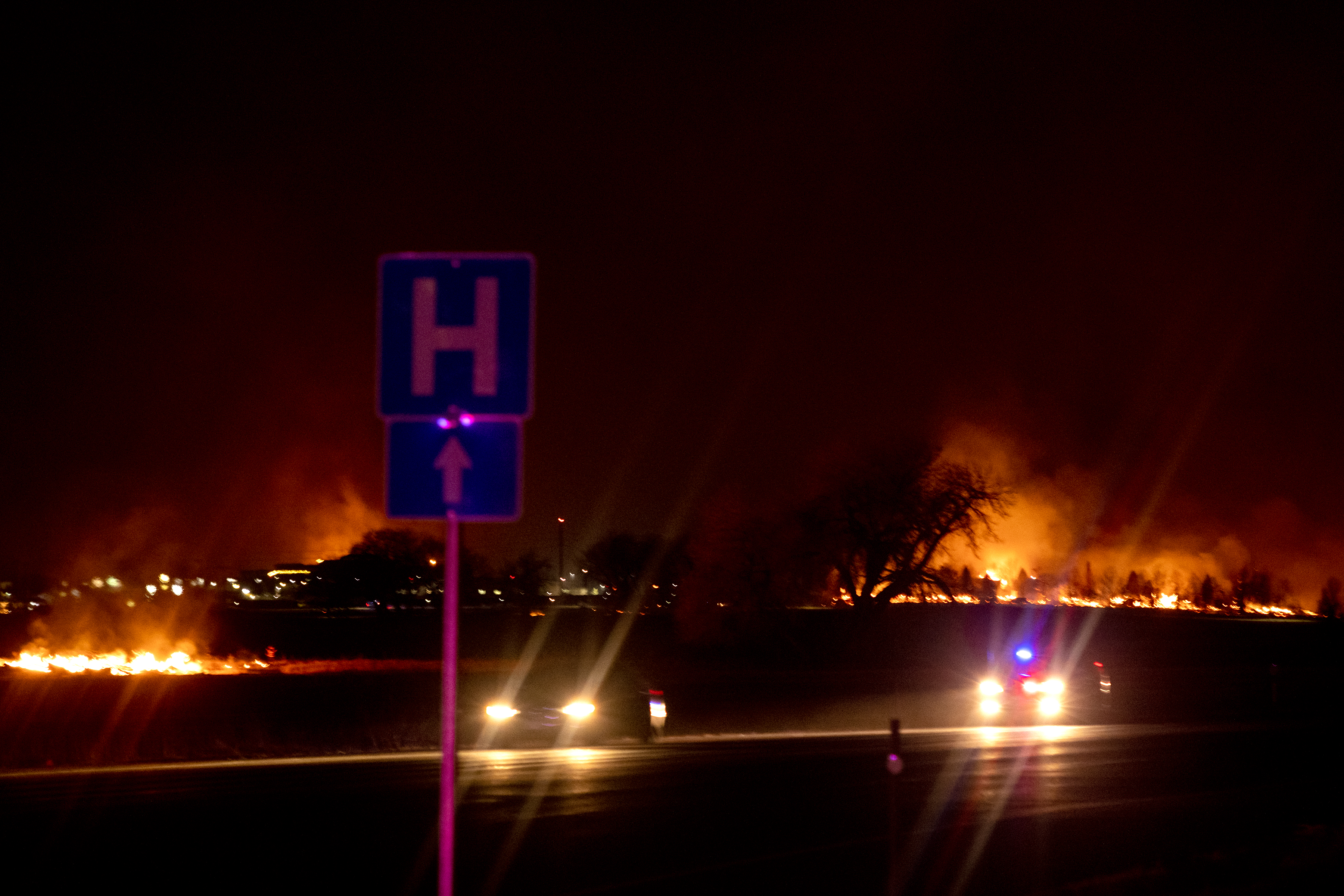 Emergency personal close down roads near 96th and Dillion Road after the Marshall fire spread rapidly through grasslands. The wind-driven fire moved east through Boulder County damaging and destroying homes as it burned 1,600 acres in Superior and Louisville, CO. (Carl Glenn Payne II/The Denver Gazette) (Carl G Payne II)