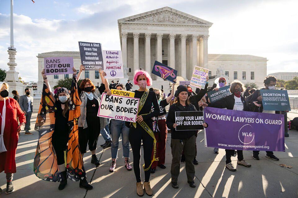 Abortion rights supporters and anti-abortion advocates rally outside the U.S. Supreme Court on Nov. 1, 2021, in Washington, D.C. (Tribune News Service)