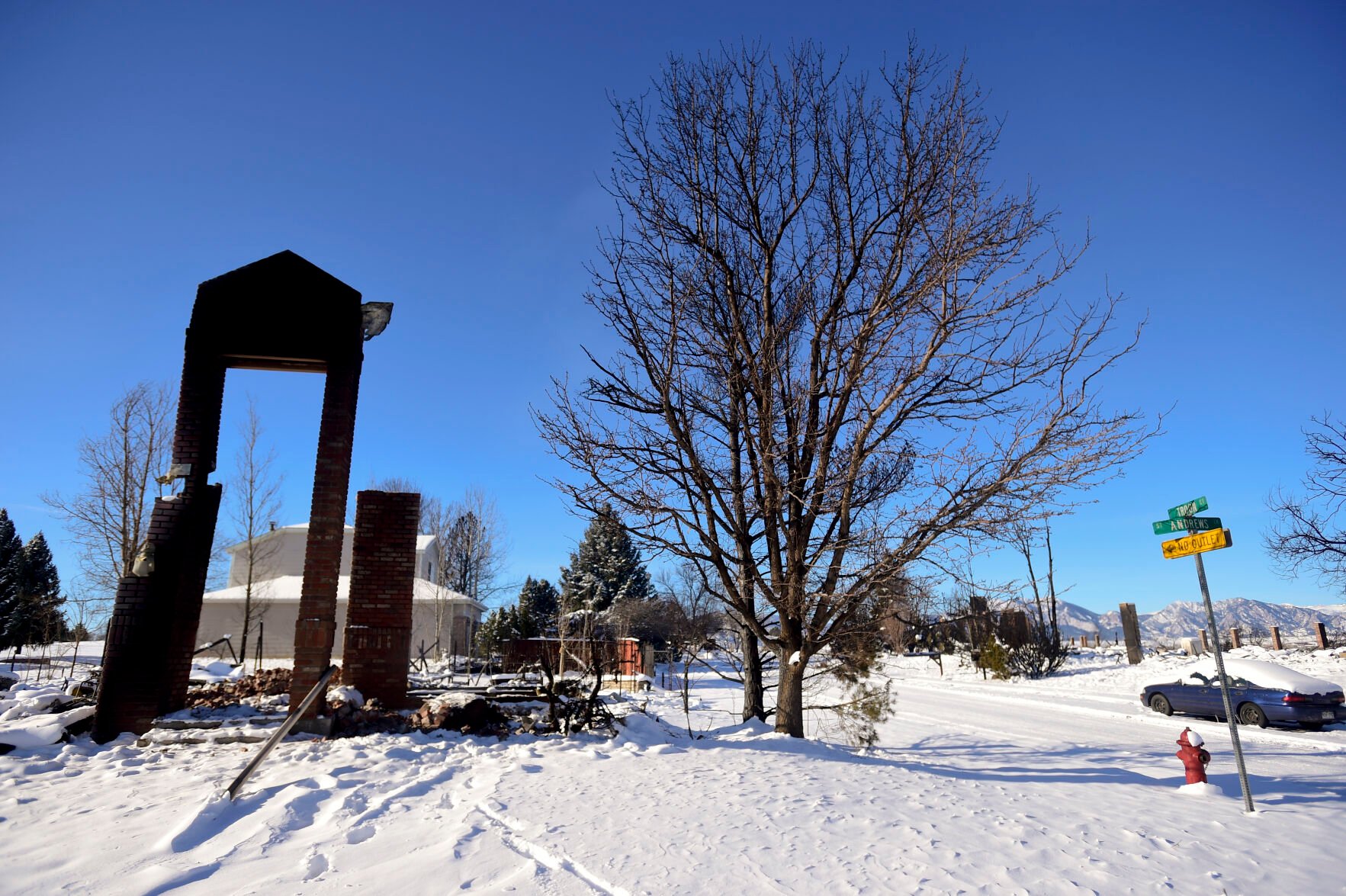 LOUISVILLE, CO - JANUARY 2:What remains of a home on the corner of St. Andrews Lane and Troon Court is seen during a tour of the Marshall Fire burn area in Louisville on Sunday, Jan. 2, 2022. The current estimate of destroyed structures is 991, while 127 structures are damaged according to Boulder County Sheriff Joe Pelle. (Matthew Jonas/Boulder Daily Camera/Pool) (Matthew Jonas)
