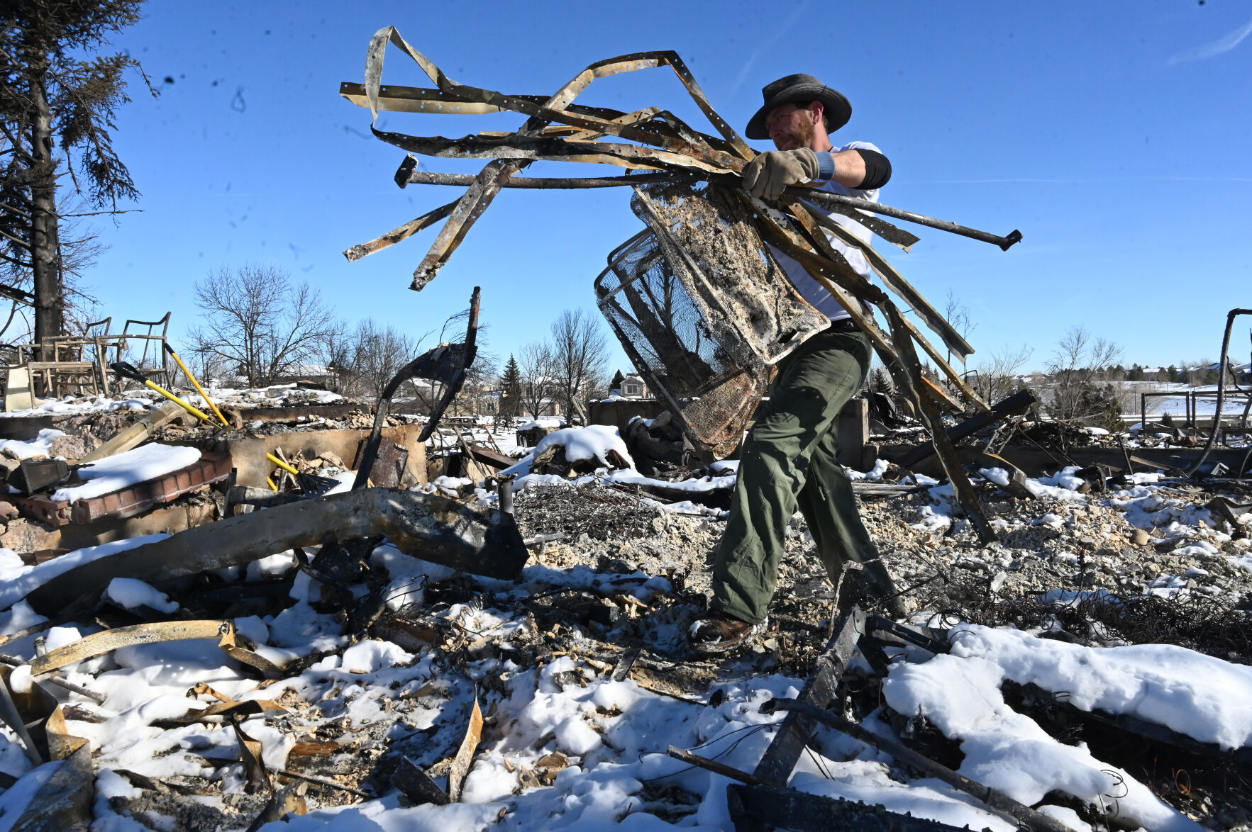 Rob Harris lost everything when his home burned during the Marshall Fire on Thursday night. He was clearing the rubble and was hoping to find the arrowheads that his father and he had collected. Harris said he and his wife are going to rebuild. (Photo by Jerilee Bennett, The Gazette) (Jerilee Bennett)