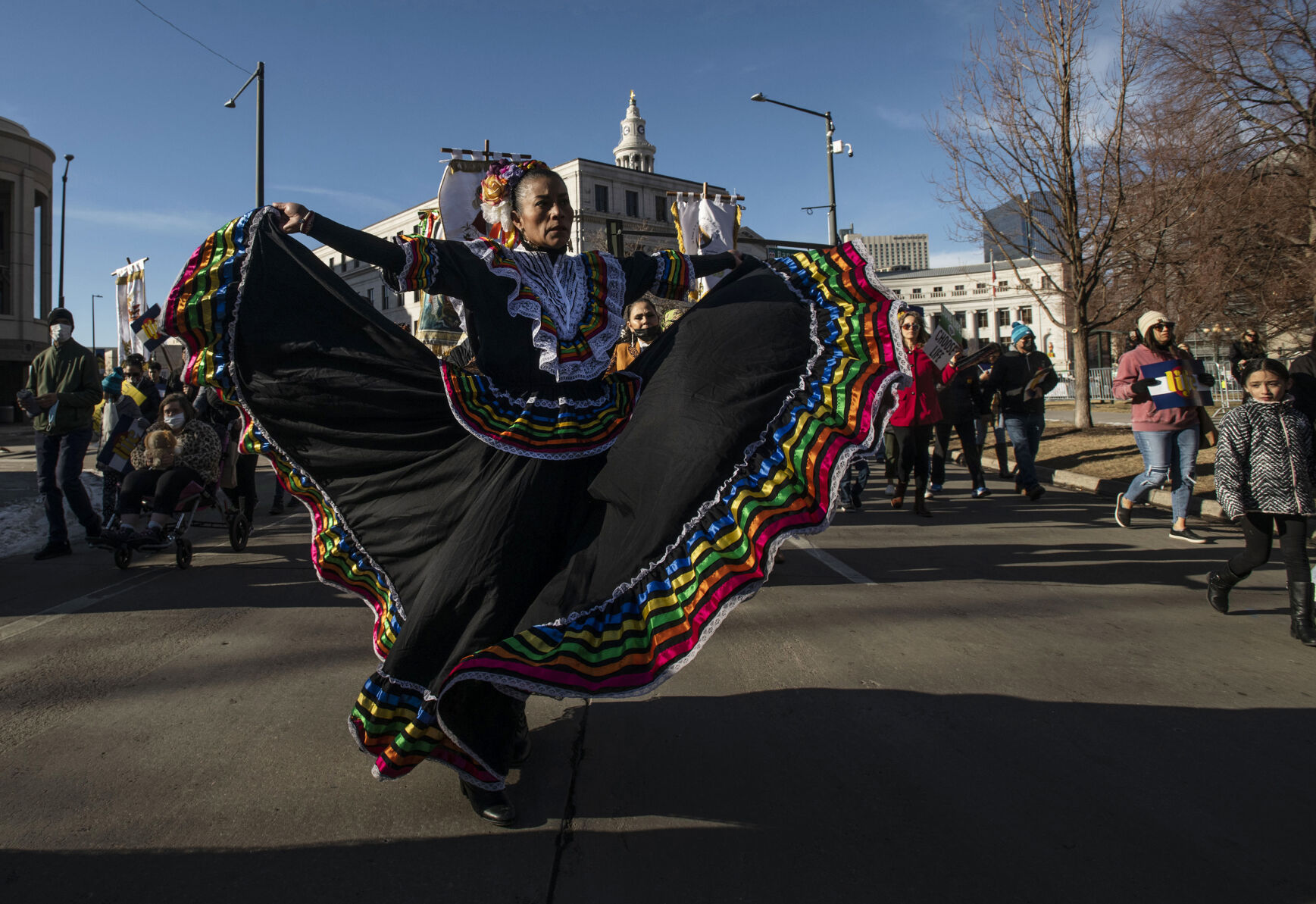 Juana Hernandez dances as thousands march around the Civic Center during the Celebrate Life Rally and March, hosted by the Archdiocese of Denver and Respect Life Denver, at the Colorado State Capitol building in Denver, Colo., on Saturday, Jan. 15, 2022. Thousands attended the annual event honoring courageous mothers. (Chancey Bush/ The Gazette) (Chancey Bush/ The Gazette)