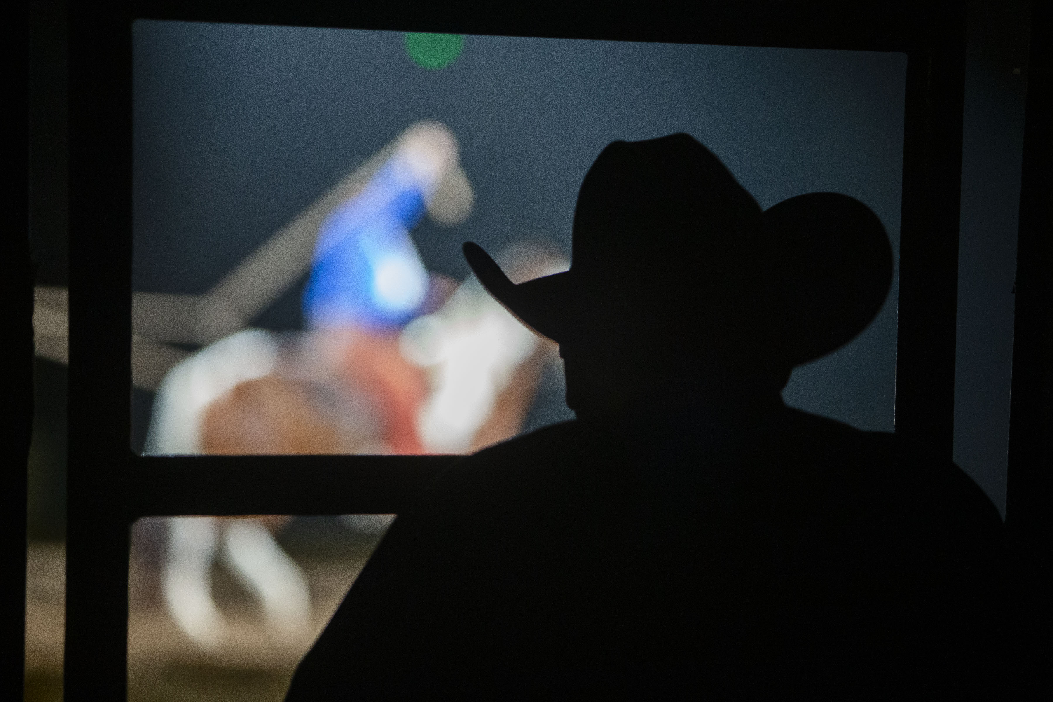 A photographer looks on during a trick roping show between events at the African-American Heritage Rodeo at the National Western Stock Show on Monday, Jan. 17, 2022, in Denver, Colo. (Timothy Hurst/The Gazette) (Timothy Hurst)