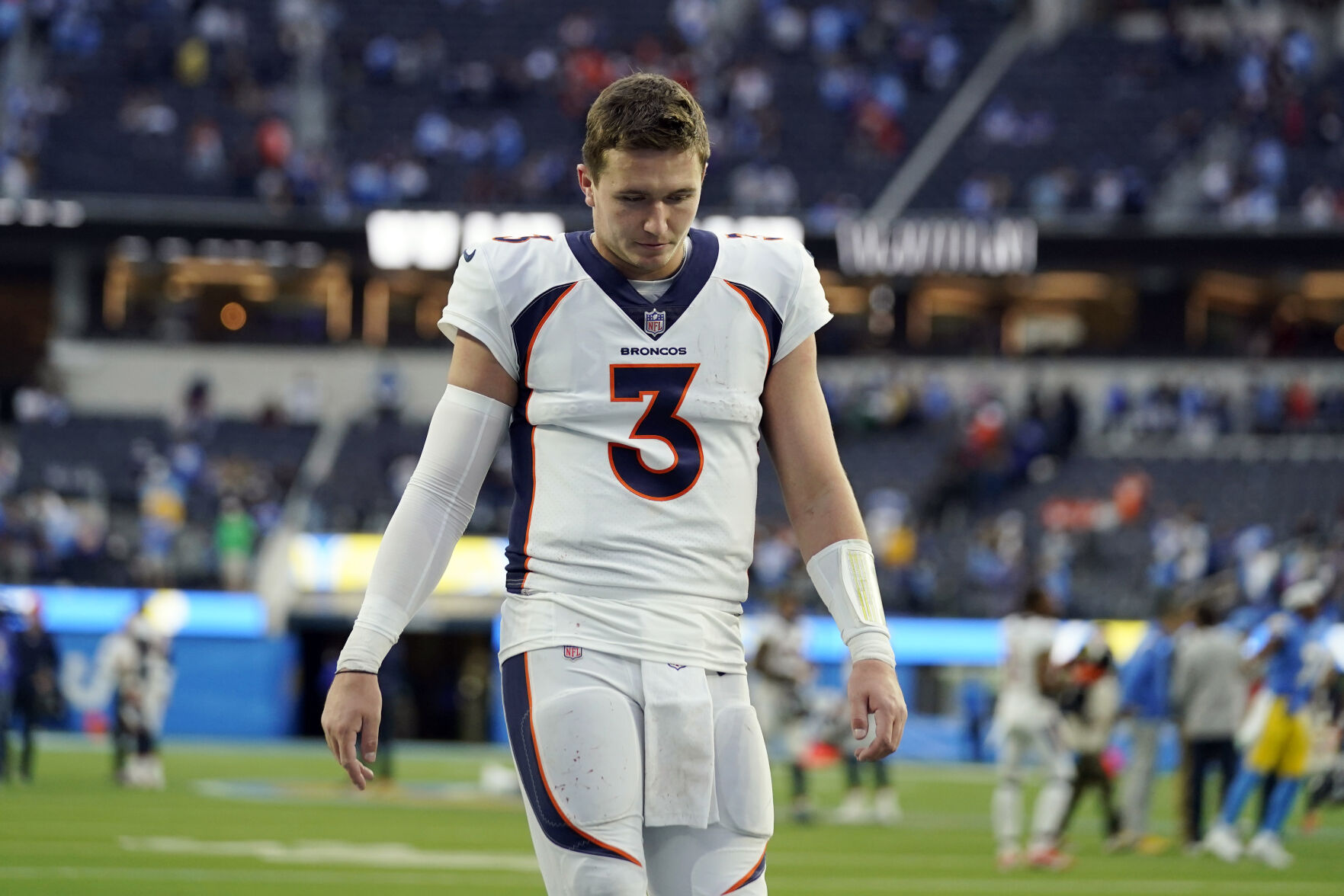 Denver Broncos quarterback Drew Lock (3) walks off the field after a loss to the Los Angeles Chargers during an NFL football game Sunday, Jan. 2, 2022, in Inglewood, Calif. (AP Photo/Jae C. Hong)