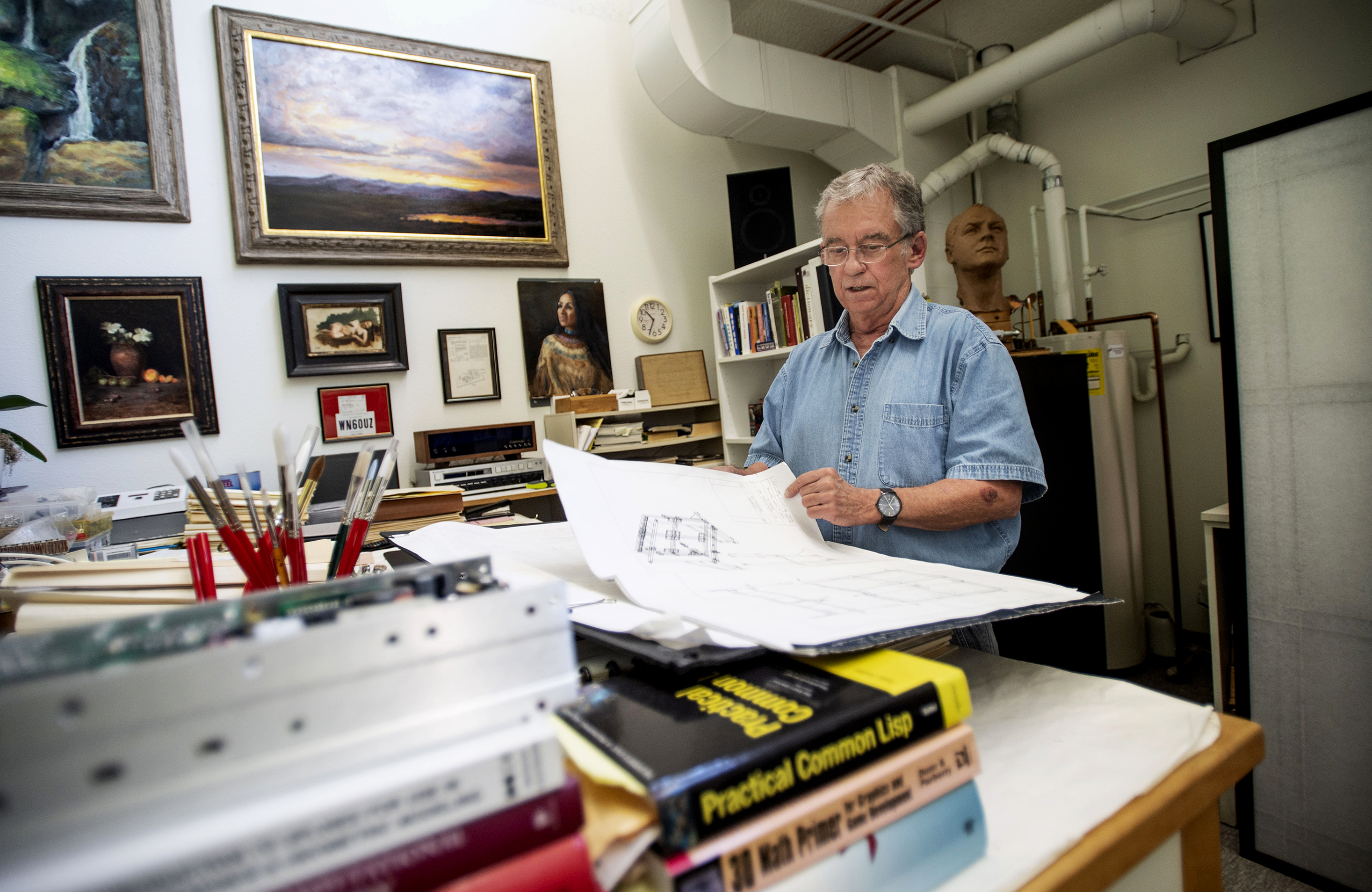 Artist Paul Kirby paints one-of-a-kind art based on computer simulations he codes for his robot, Dulcinea, his journey to fuse art and science. (Chancey Bush, The Gazette)