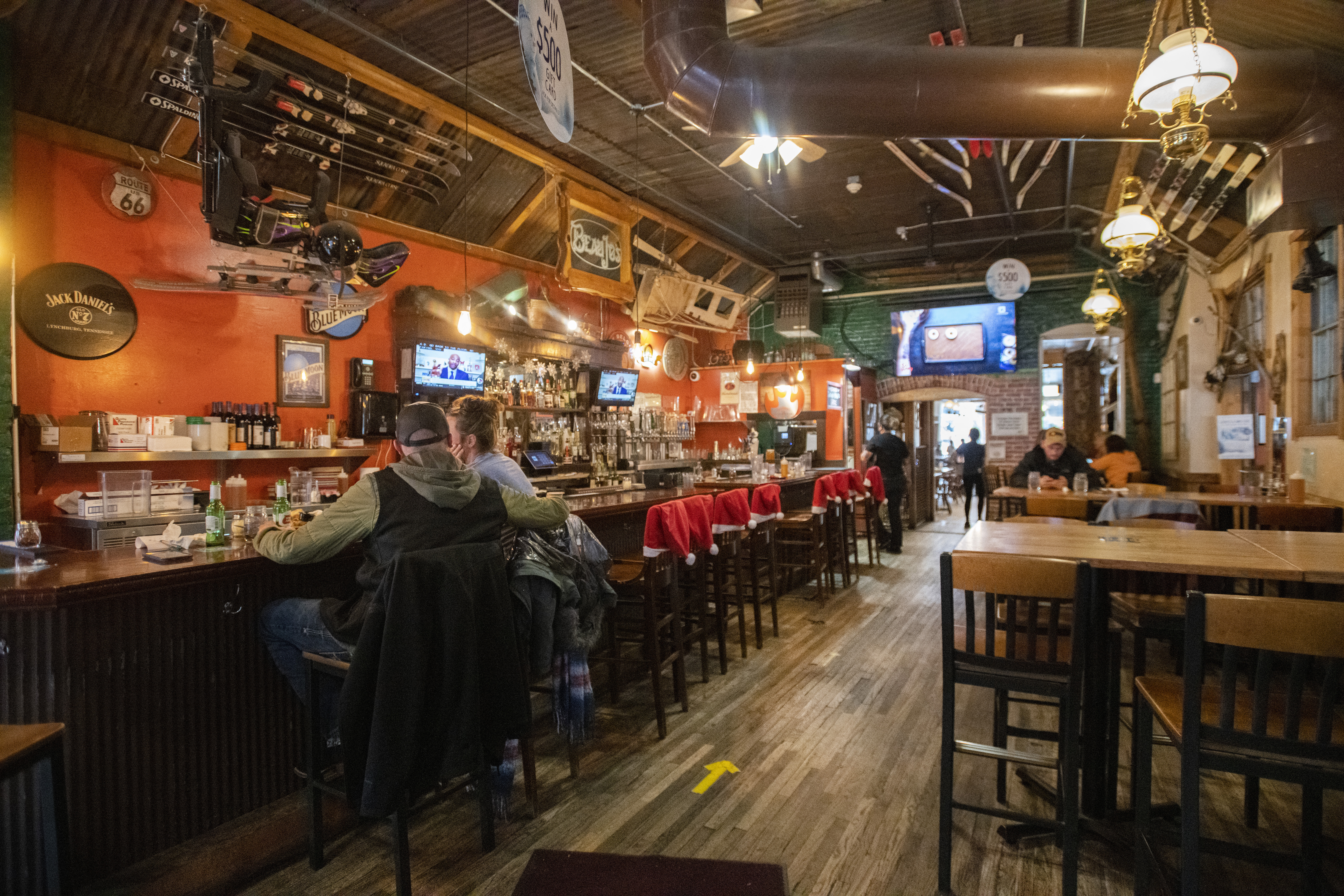 Customers sit at the bar of the flagship Beau Jo’s in Idaho Springs on Thursday, Dec. 9, 2021. (Christian Murdock, The Gazette)