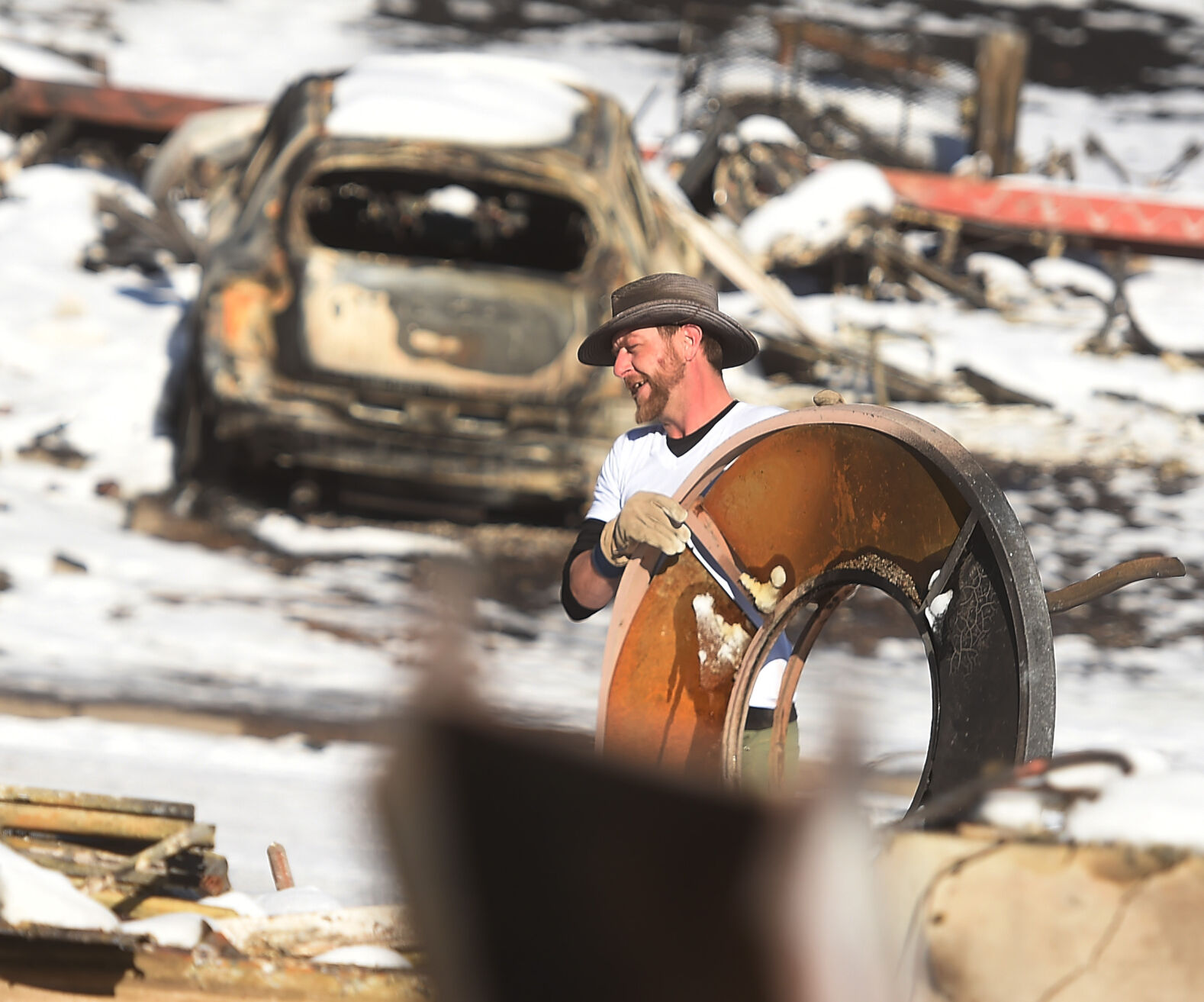 Rob Harris lost everything when his home burned during the Marshall Fire. He was clearing the rubble shortly after the Dec. 30 blaze. Harris said he and his wife are going to rebuild. (Photo by Jerilee Bennett, The DenverGazette) (Jerilee Bennett/The Denver Gazette)