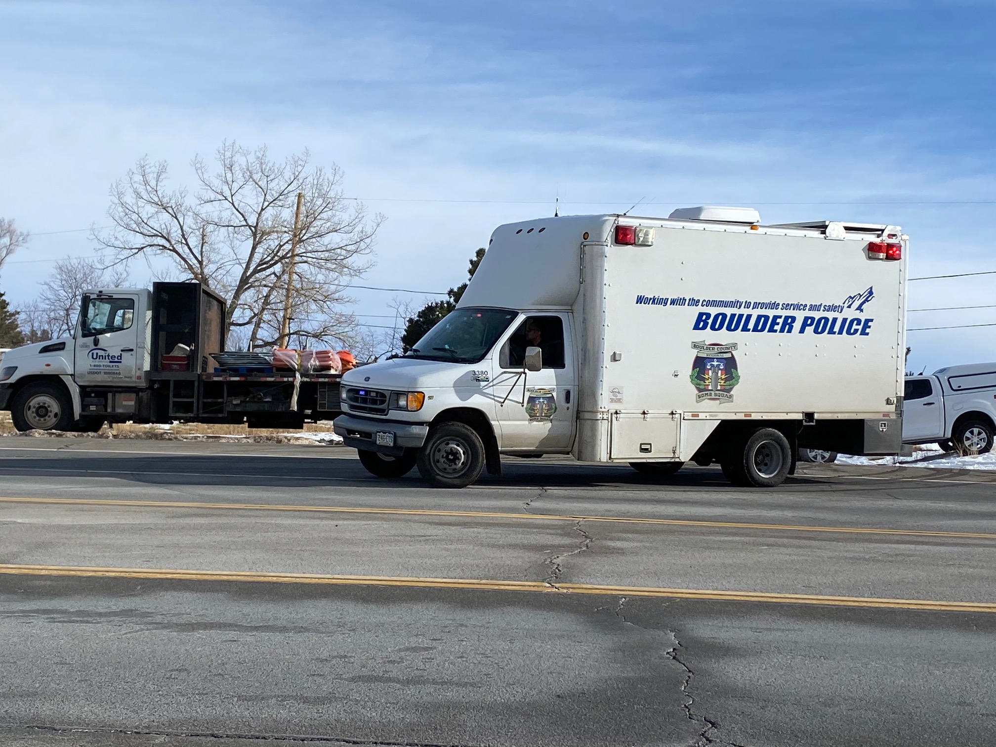 A Boulder police bomb squad vehicle pulls out of the Twelve Tribes property at Marshall Road and Highway 93 (Carol McKinley)