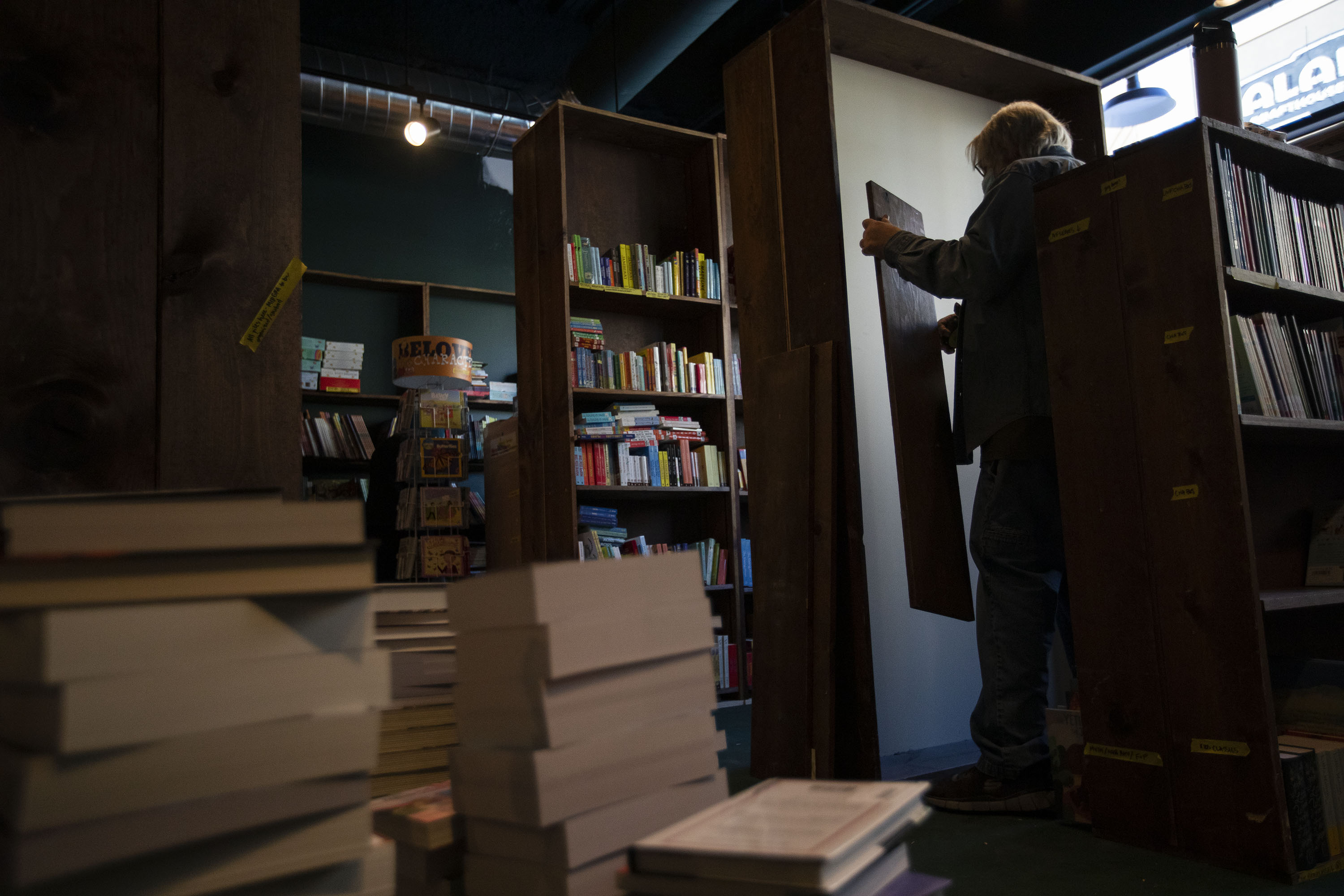 Ron Dirlam, who’s built all the shelves for the Tattered Cover’s new locations, inserts a shelf into place in the children’s section Tuesday in preparation of the store opening its newest location in Westminster. Dirlam has built all the shelves for all of the Tattered Cover’s new locations. (TimHursttim.hurst@gazette.comhttps://secure.gravatar.com/avatar/aca82bd62b4ee425c598527cd6faa1b1?d=mm&r=g)