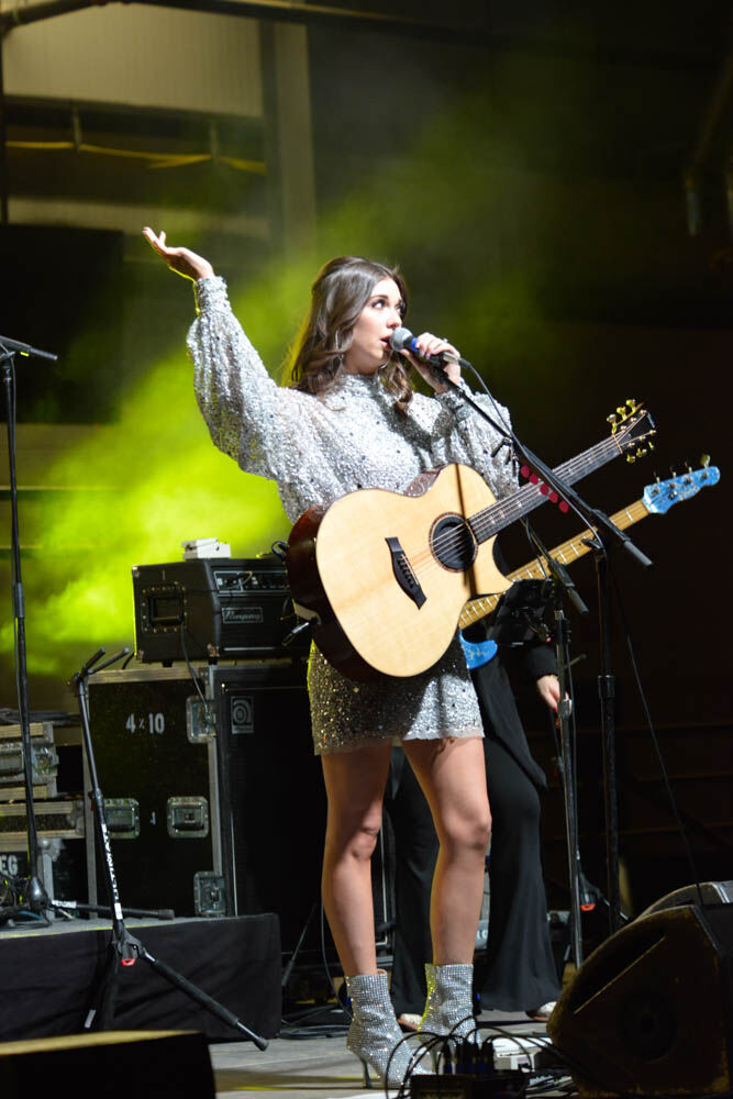 Country western artist and Nashville native Jenny Tolman performs at the grand opening of the H.W. Hutchison Family Stockyards Event Center and the Ron and Cille Williams Yards. (ScottWeiserEnterprise Reporterscott.weiser@gazette.comhttps://secure.gravatar.com/avatar/bedf4ba0a073402c3991ce97ce2869c4?d=mm&r=g)