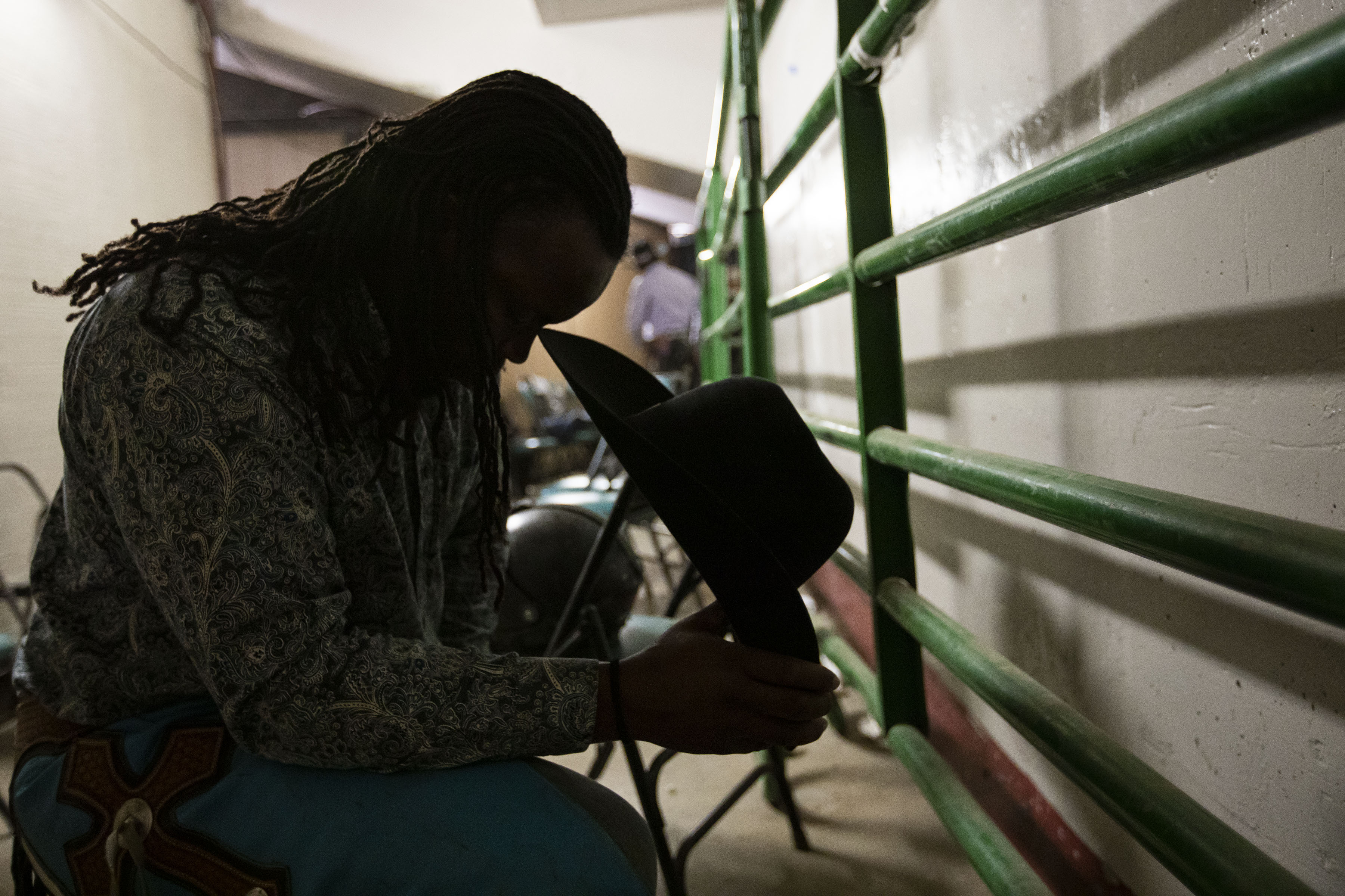 Bullrider Leondie Linebarger prays backstage before riding during the African-American Heritage Rodeo at the National Western Stock Show on Monday, Jan. 17, 2022, in Denver, Colo. (Timothy Hurst/The Gazette) (Timothy Hurst)