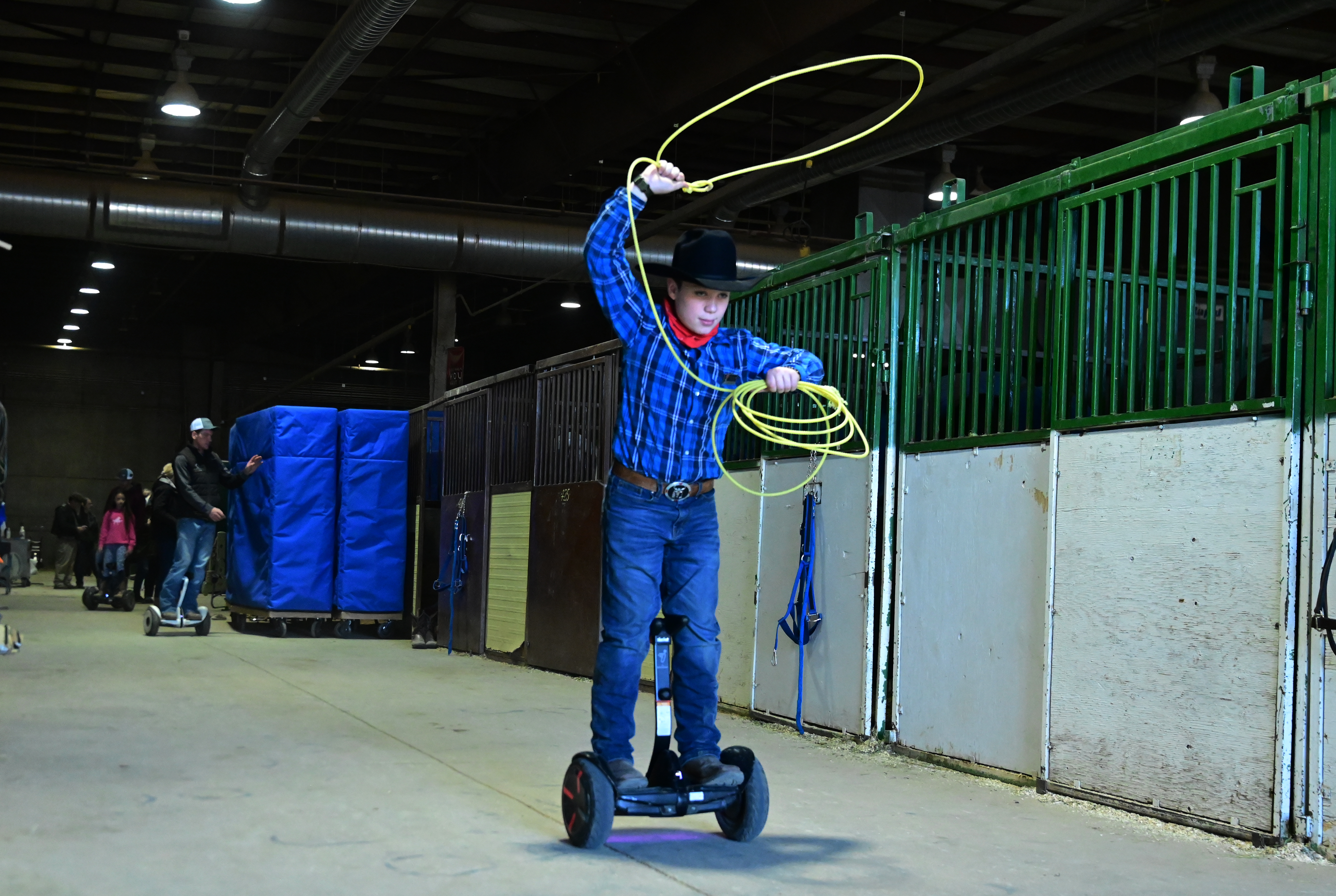Chaz Boeder practices riding a personal transporter and roping at the same time on the last day of the National Western Stock Show on Sunday, Jan. 23, 2022. (Photo by Jerilee Bennett, The Gazette) (Jerilee Bennett)