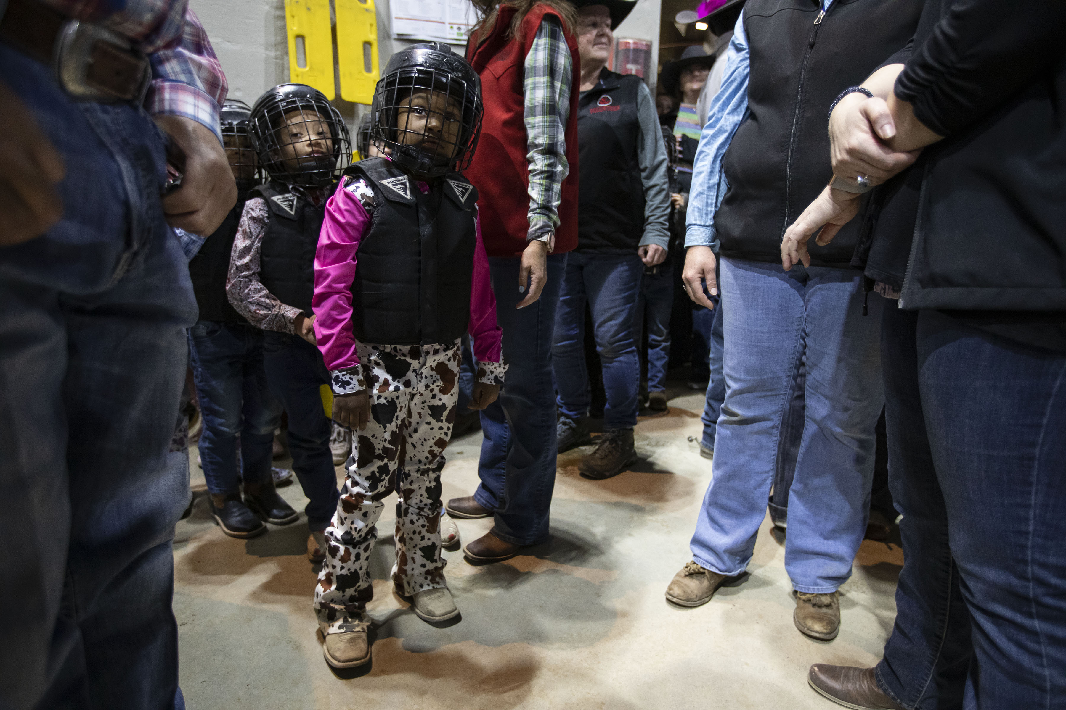 Kendall Henderson looks out to the arena with other children before participating in the mitten busting show during the African-American Heritage Rodeo at the National Western Stock Show on Monday, Jan. 17, 2022, in Denver, Colo. (Timothy Hurst/The Gazette) (Timothy Hurst)