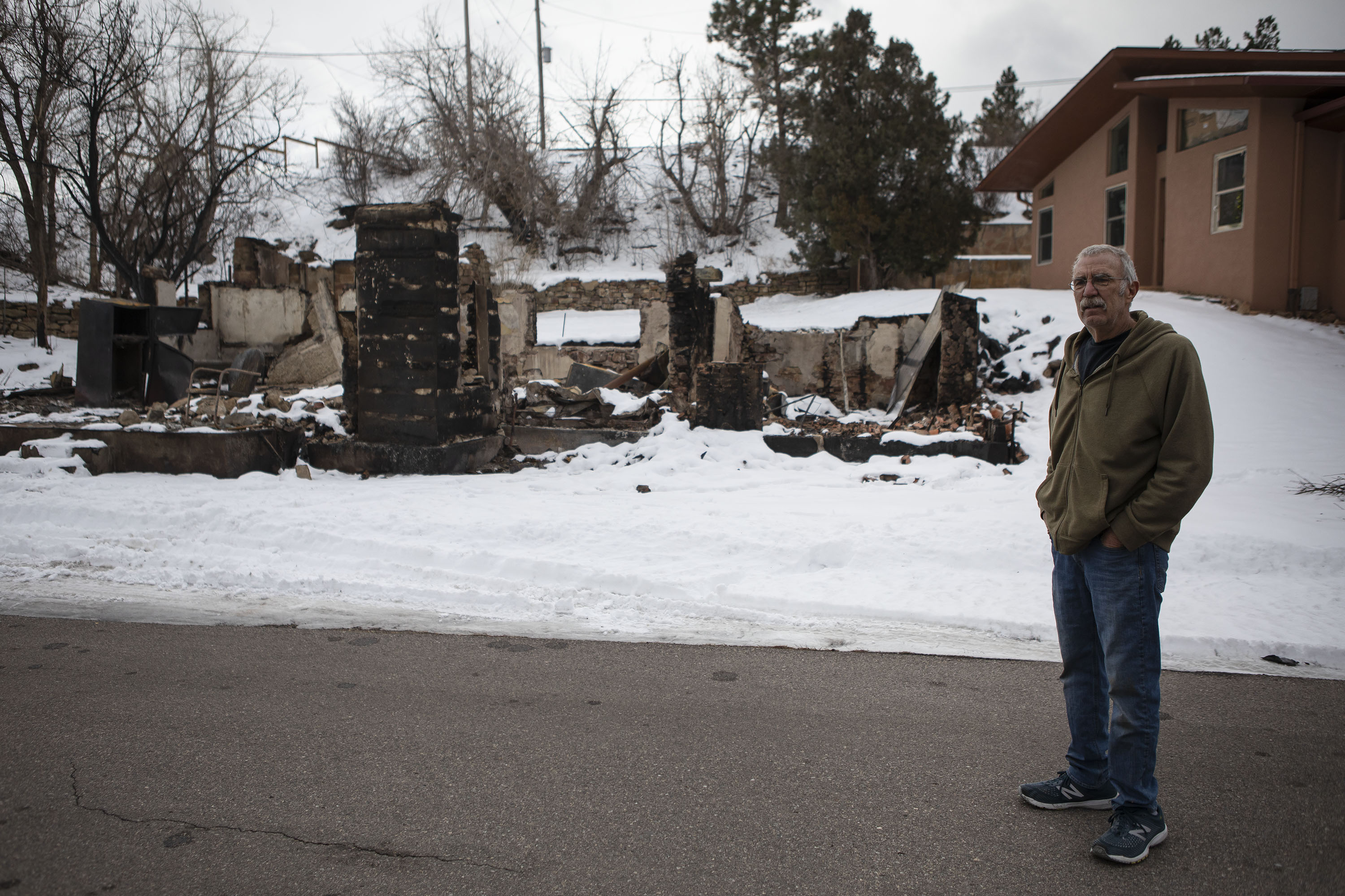 Resident Bob Gabriella, whose family has lived on Marshall Road in what is now unincorporated Boulder County for generations, stands in front of the burned remains of one of his family’s building originally built in 1865, while surveying damage on Marshall Road on Wednesday, Jan. 5, 2022, in unincorporated Boulder County, Colo. (Timothy Hurst/The Gazette) (Timothy Hurst)