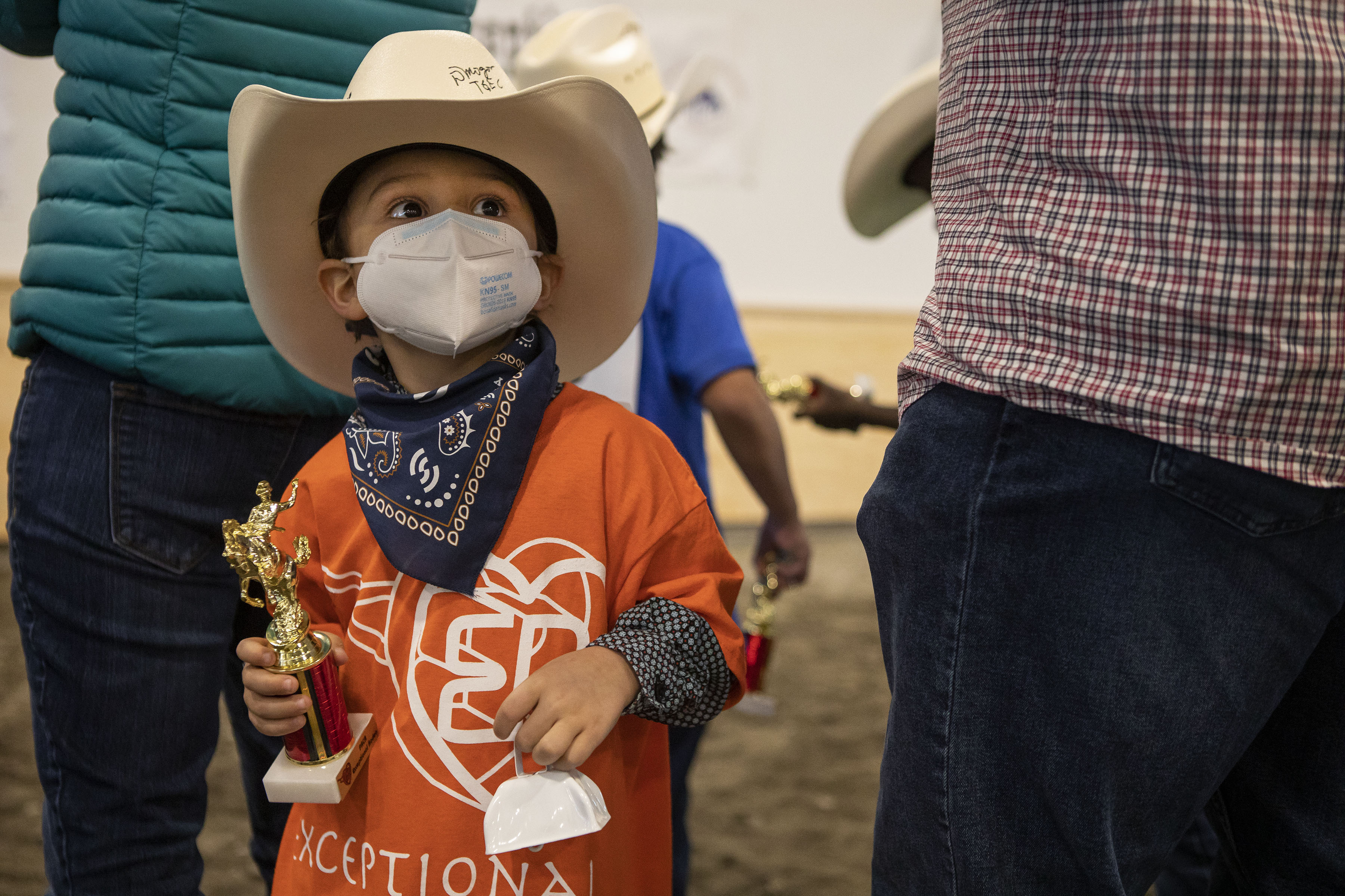Teddy Crow, 4, holds his trophy and cowbell during the Exceptional Rodeo in the Temple Grandin Equine Center on Thursday, Jan. 20, 2022, at the CSU Spur Campus in Denver, Colo. (Timothy Hurst/The Gazette) (Timothy Hurst)