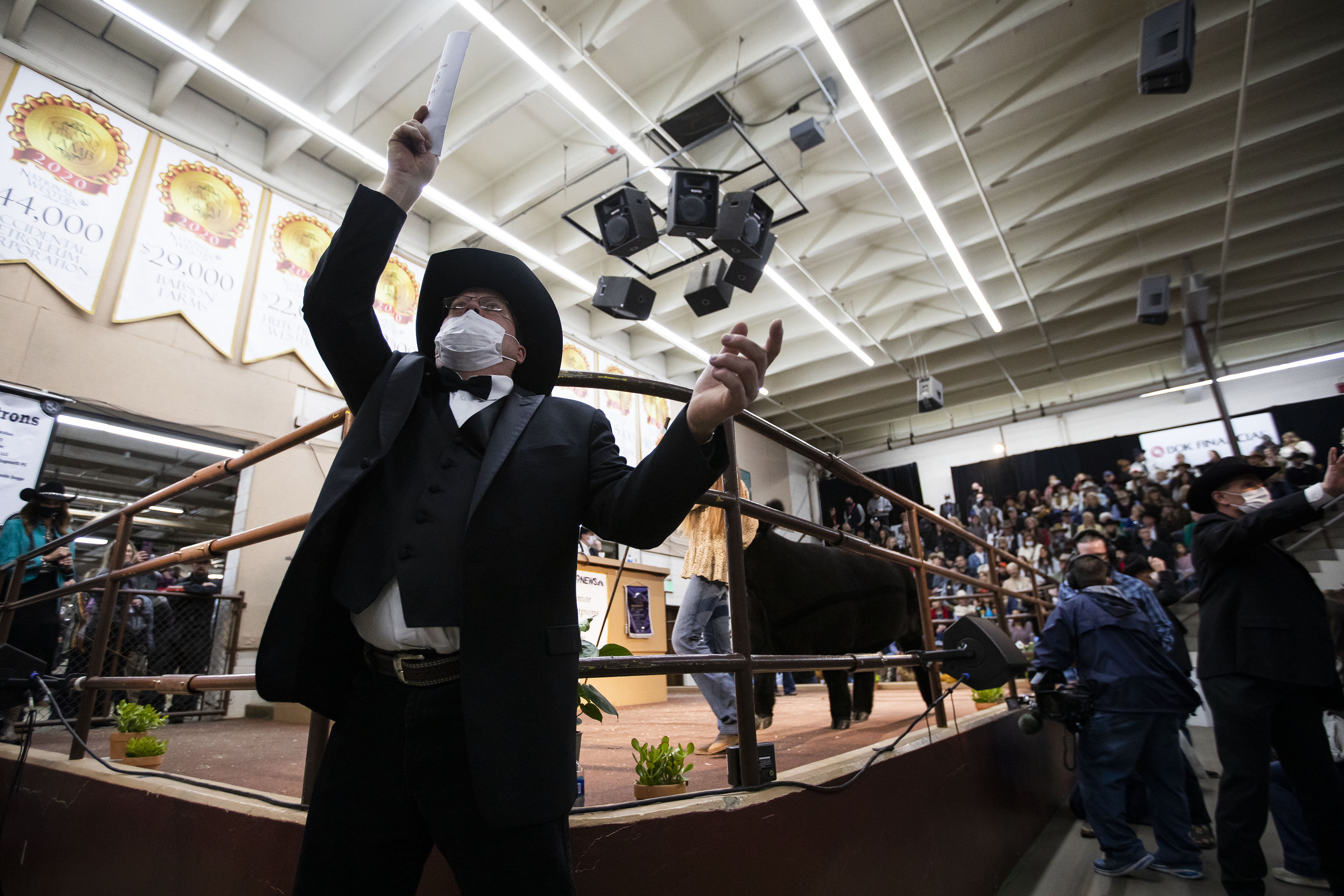 An auctioneer keeps an eye out for bidders during the National Western Stock Show Junior Livestock Champions Auctions on Friday, Jan. 21, 2022, in Denver, Colo. (Timothy Hurst/The Gazette) (Timothy Hurst)