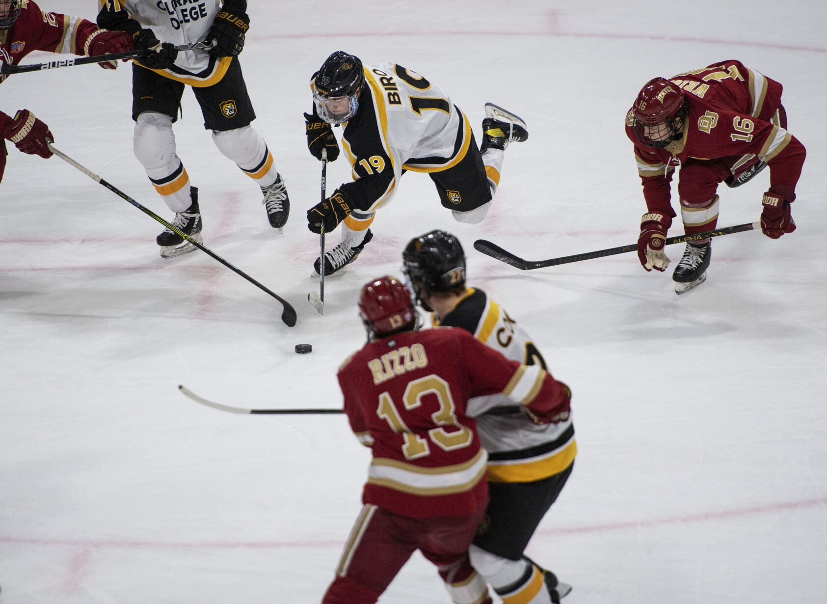 Colorado College sophomore left-wing Jordan Biro (19) drives toward the puck as the CC Tigers take on the University of Denver Pioneers at Ed Robson Arena on the campus of Colorado College in Colorado Springs Colo., on Saturday, Jan. 22, 2022. (Chancey Bush /The Gazette) (Chancey Bush/ The Gazette)