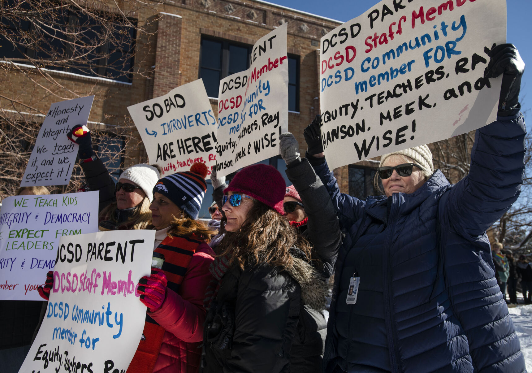 Hundreds of people, including teachers, students and parents gather outside the Douglas County School District headquarters in protest of the school board majority’s alleged secret meeting about forcing out superintendent Corey Wise, in Castle Rock, Colo., on Thursday, Feb. 3, 2022. The “Collaborative Action