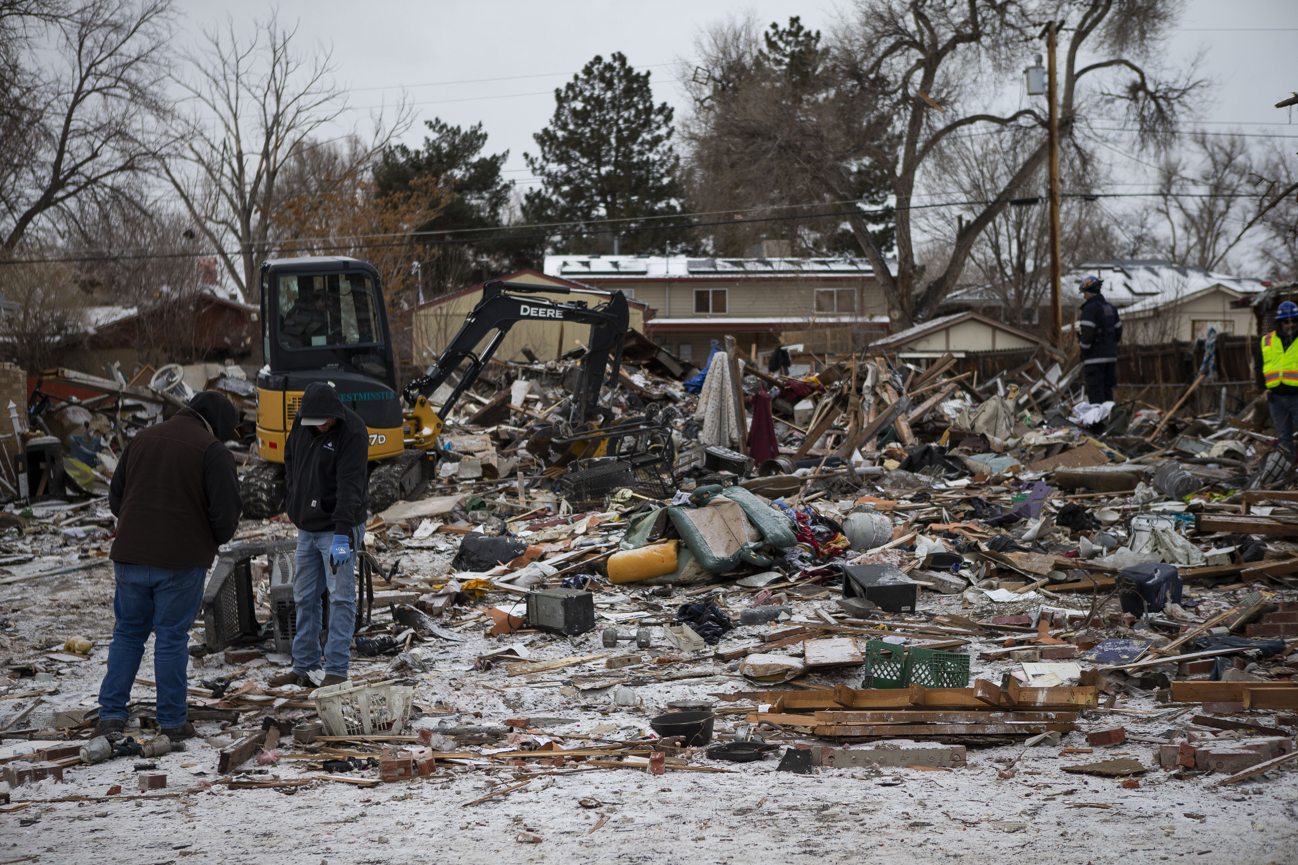 Crews look over the debris from a home that exploded on the 7700 block of Knox Court on Tuesday, Feb. 22, 2022, in Westminster, Colo. (Timothy Hurst/The Denver Gazette) (Timothy Hurst)
