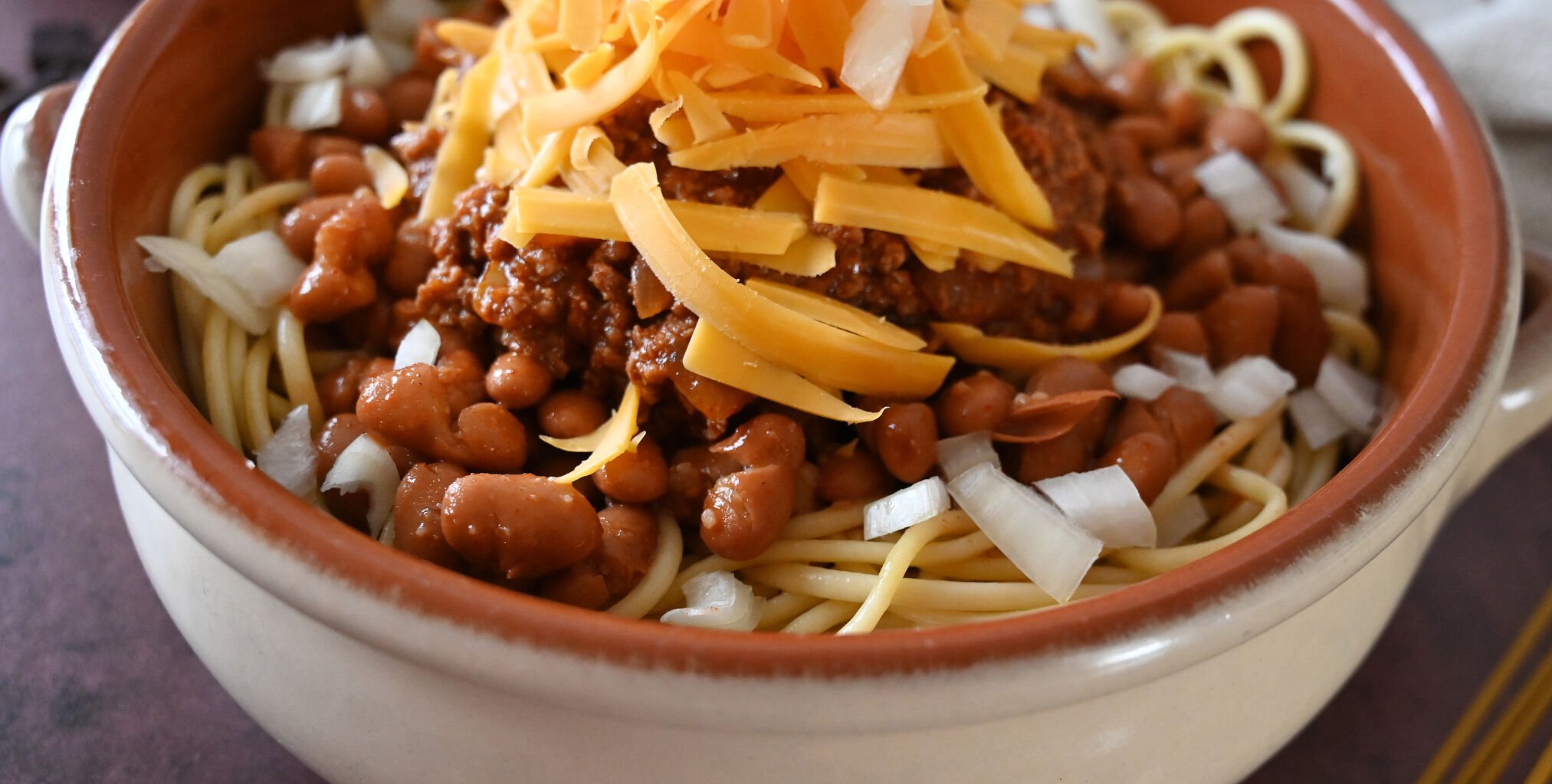 One way to serve Cincinnati chili is with layers of spaghetti, chili, cheese and onions. (Photo by Jerilee Bennett, The Gazette) (Jerilee Bennett, The Gazette)