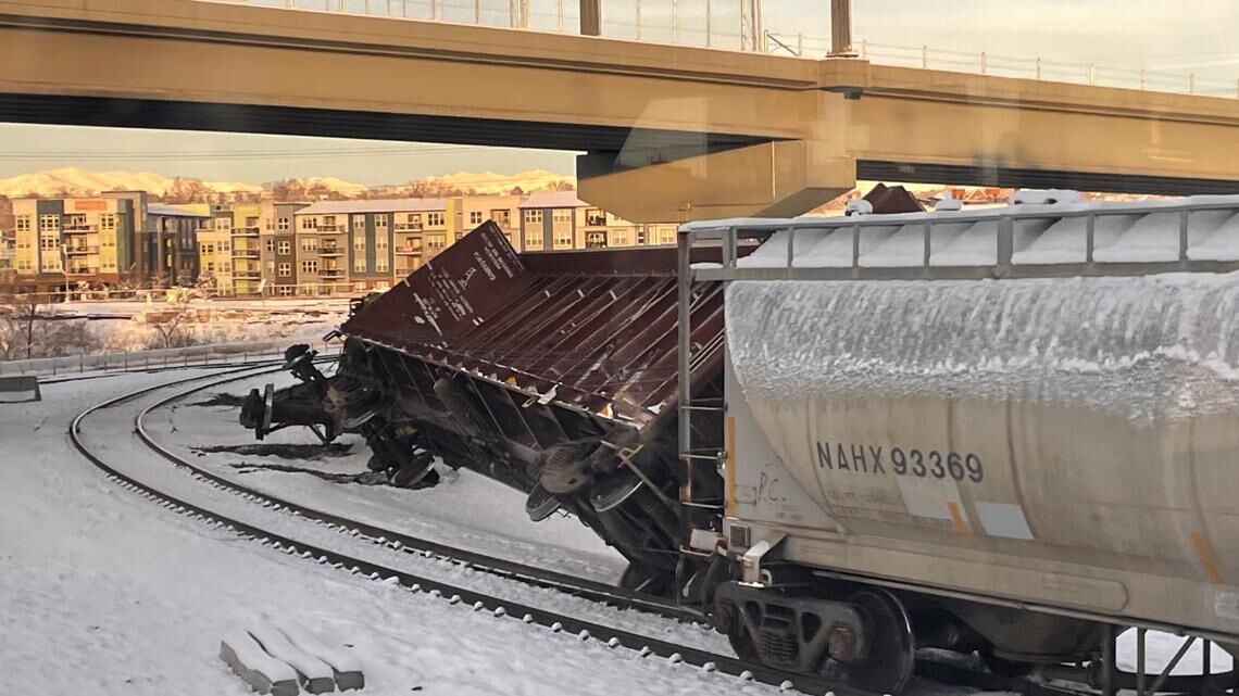 Freight train derails in Denver, sends several train cars into the river