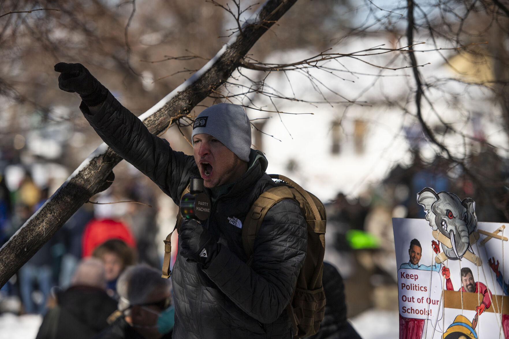 Hundreds of people gather outside the Douglas County School District headquarters in protest of the school board majority’s alleged secret meeting about forcing out superintendent Corey Wise, in Castle Rock, Colo., on Thursday, Feb. 3, 2022. The “Collaborative Action