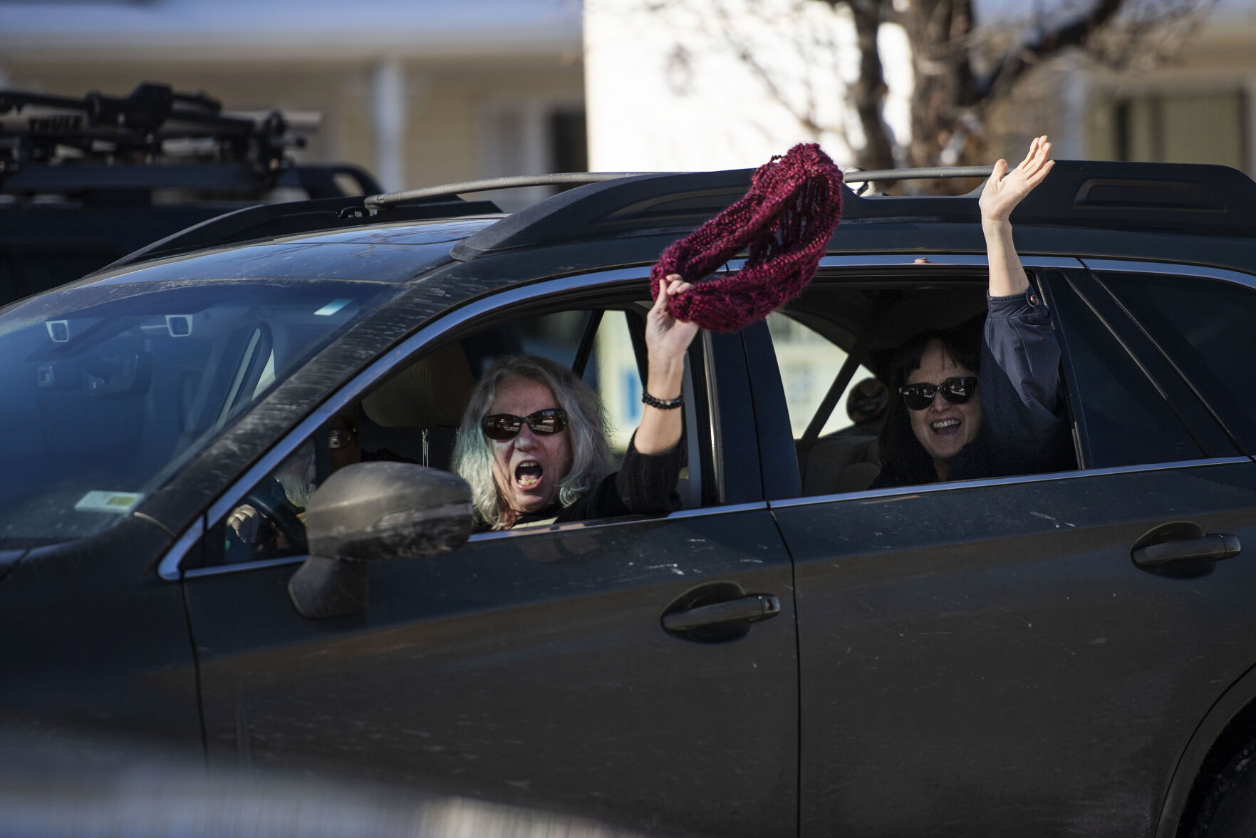 People drive by and show their support as hundreds of people gather outside the Douglas County School District headquarters in protest of the school board majority’s alleged secret meeting about forcing out superintendent Corey Wise, in Castle Rock, Colo., on Thursday, Feb. 3, 2022. The “Collaborative Action