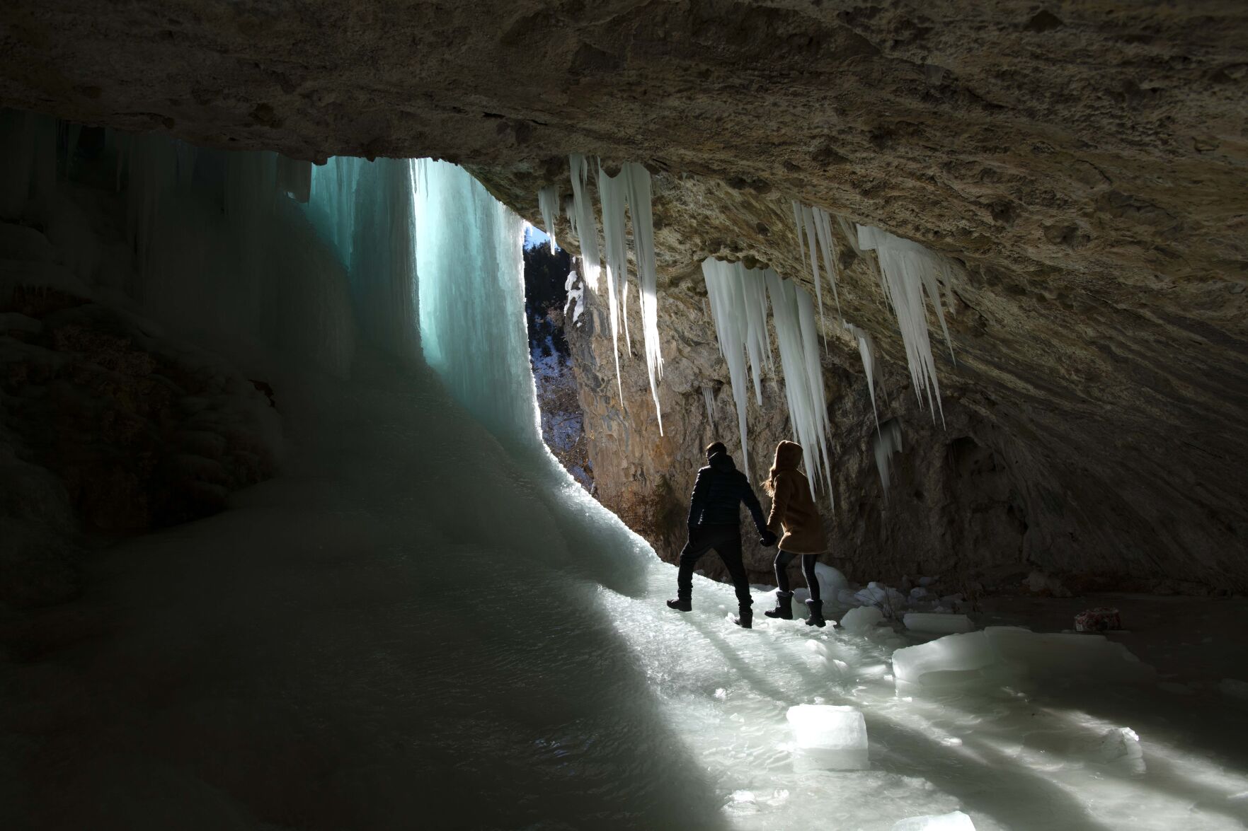 Marco Miglionico, left, and Alejandra Martinez, from Atlanta, explore the Ice Caves in the Rifle Mountain Park outside Rifle last month. The caves can be reached from the Kopers Trail in the park, which is owned by the city of Rifle. Photo Credit: Christian Murdock, The Gazette (Christian Murdock, The Gazette)