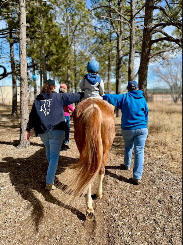 Volunteers and staff assist some 700 clients a year at StableStrides, which provides horse therapy for adults and children struggling with mental health problems or various disabilities. (Courtesy photo) (Courtesy photo)