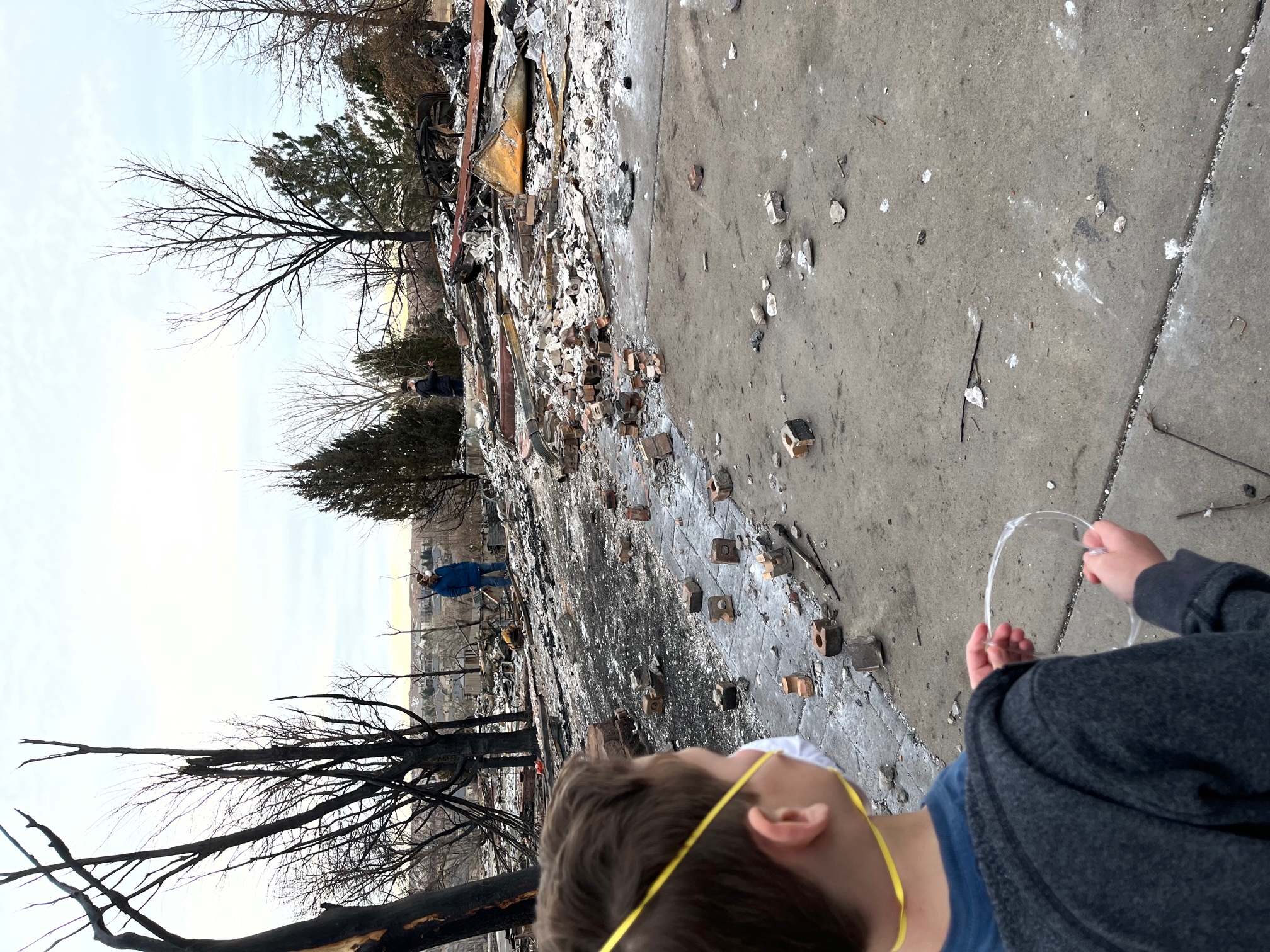 Trisha and Chad Cheek brought their second grade son to say goodbye to their Superior home. They lost everything they owned in the Marshall fire and hope to rebuild on their property by 2023. (Courtesy of Chad Cheek)