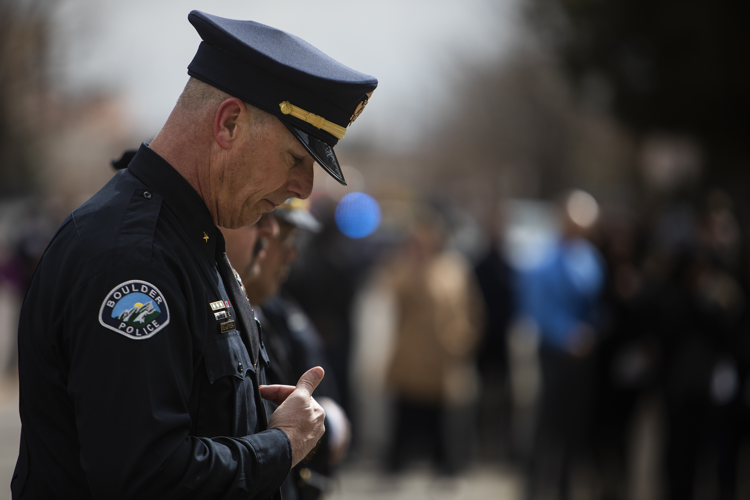 Boulder Police Department Cmrd. Barry Hartkopp does the sign of the cross after a prayer during a Line of Duty Death commemoration for officer Eric Talley at the Boulder Police Department on Tuesday, March 22, 2022, in Boulder, Colo. (Timothy Hurst/The Denver Gazette) (Timothy Hurst)