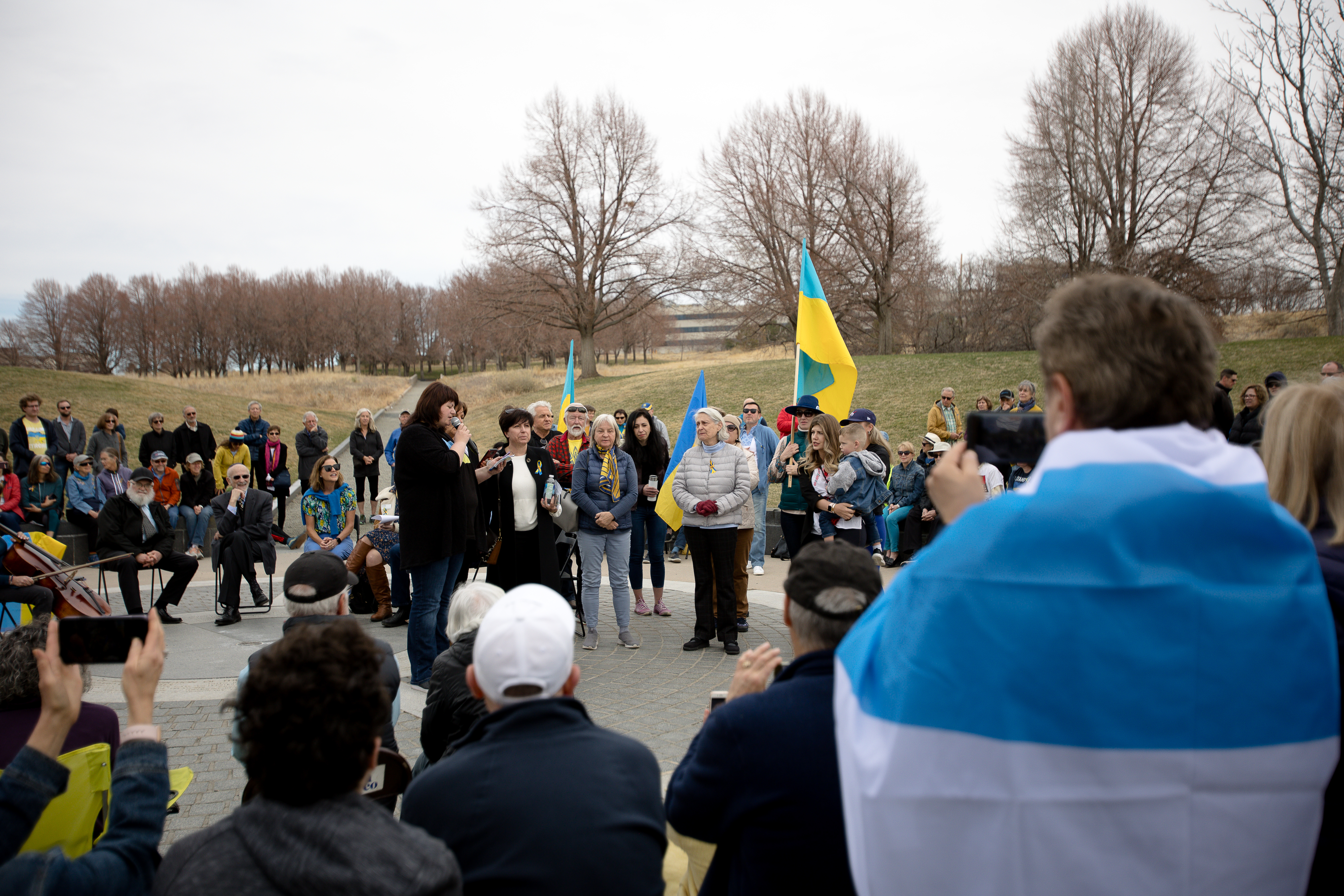 Standing among fellow Ukrainians, Irina Shatalov led the group in a Ukrainian prayer Sunday, March 27. ((Sara Hertwig/for The Denver Gazette))