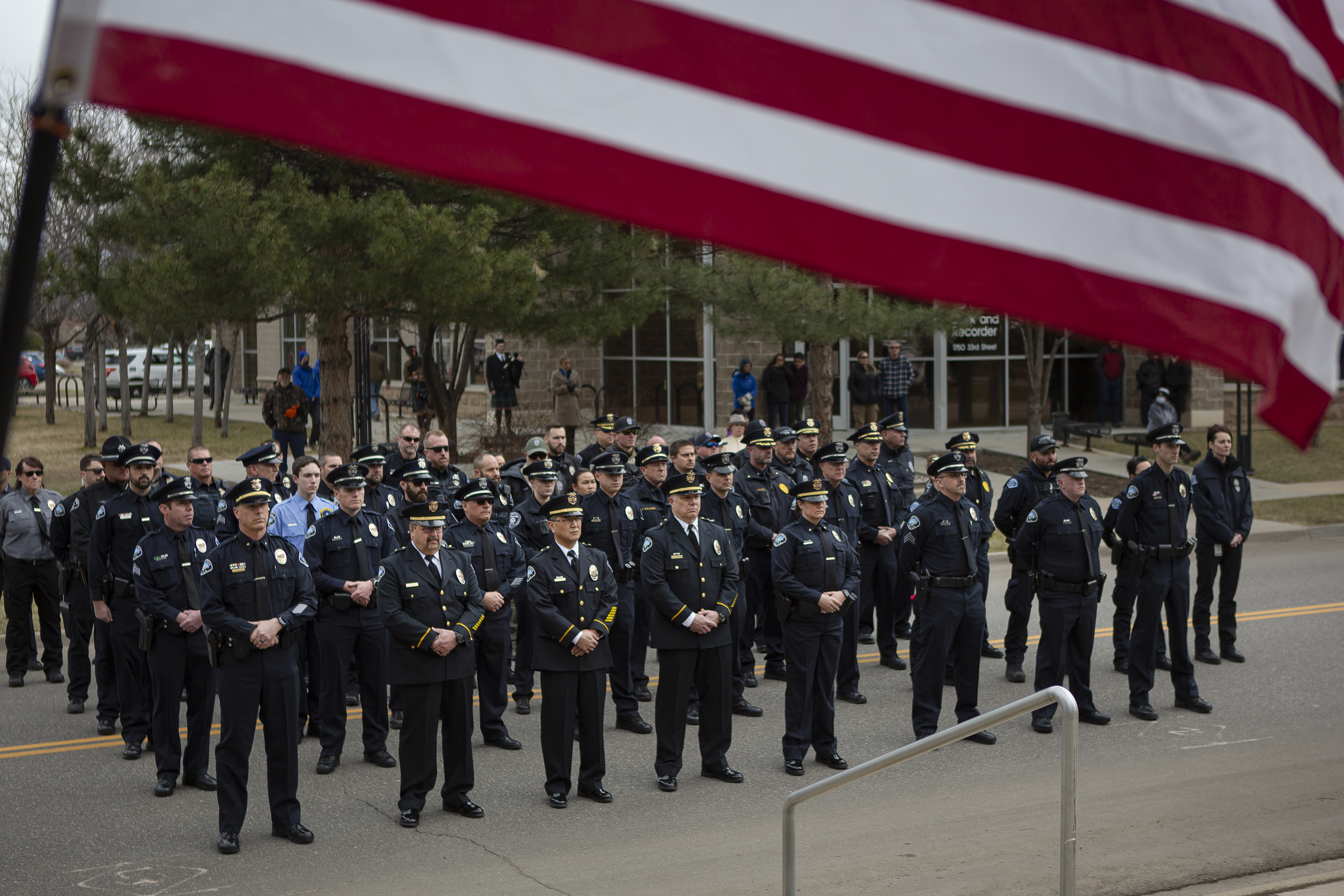 Area police officers stand in the blocked off 33rd Street during a Line of Duty Death commemoration for officer Eric Talley at the Boulder Police Department on Tuesday, March 22, 2022, in Boulder, Colo. (Timothy Hurst/The Denver Gazette) (Timothy Hurst)