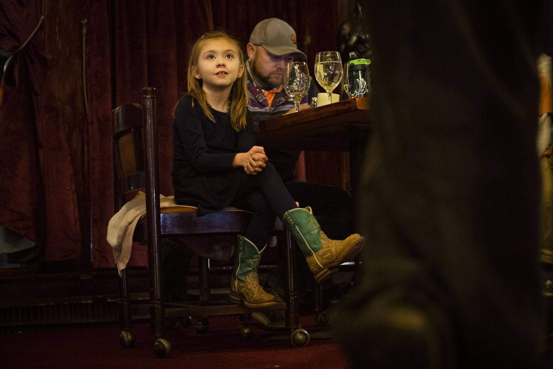 Ambree Sasina, 7, watches Frank Cordova, 78, owner of Rino’s Italian Restaurant and Steakhouse, sing for his guests at his restaurant in Trinidad, on Feb. 23, 2022. Cordova and his brother Bob spent over 20 years in Las Vegas in the music industry and are known as the “original singing waiters” of Las Vegas. (Chancey Bush, The Gazette)